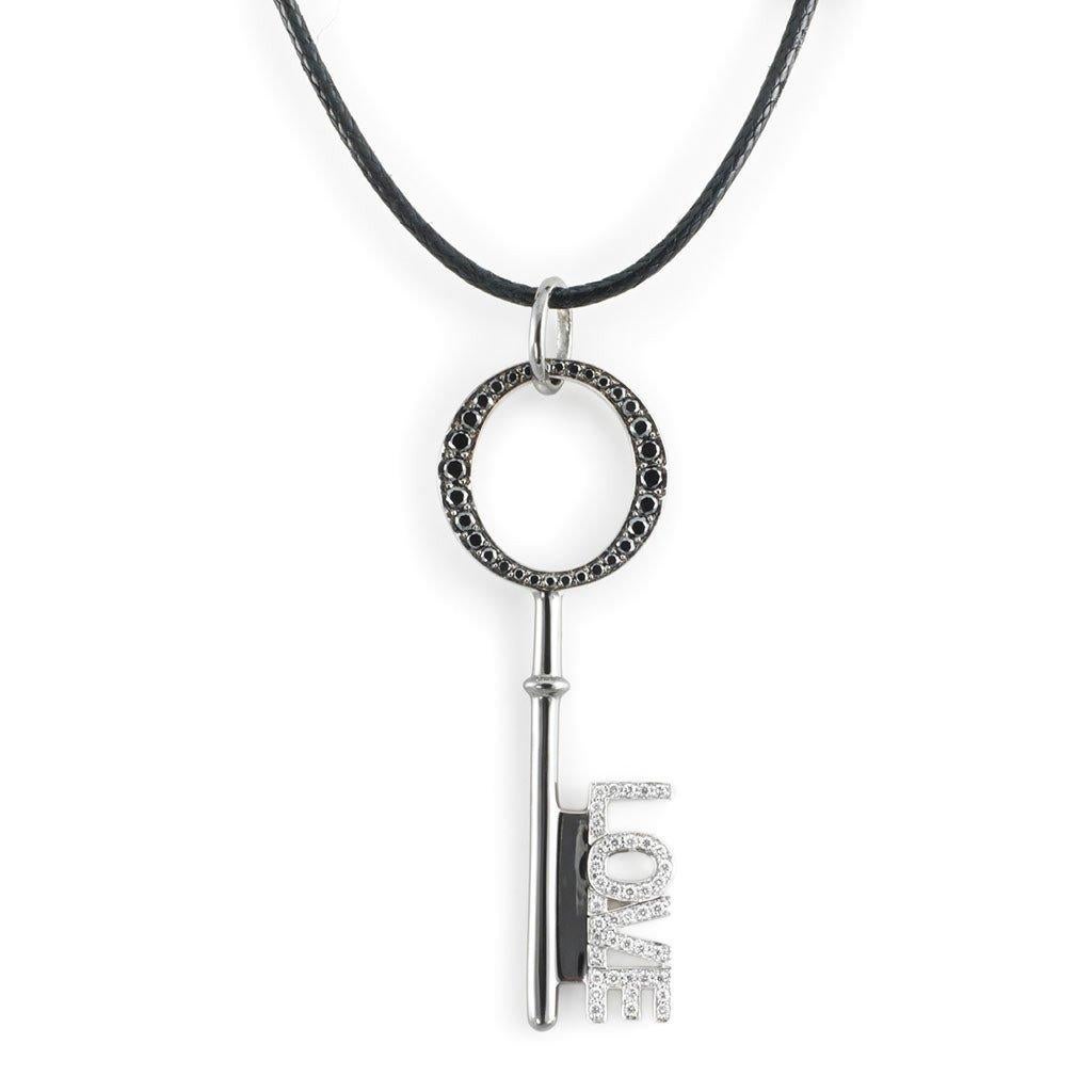 This LOVE Key Pendant with White and black diamonds is handcrafted in white gold, sterling silver, rhodium on a cotton cord.

Stones: White (F-G/VVS) and black diamonds: 0,43ct.
Material: White Gold 18k, Sterling Silver 925, Black Rhodium

The