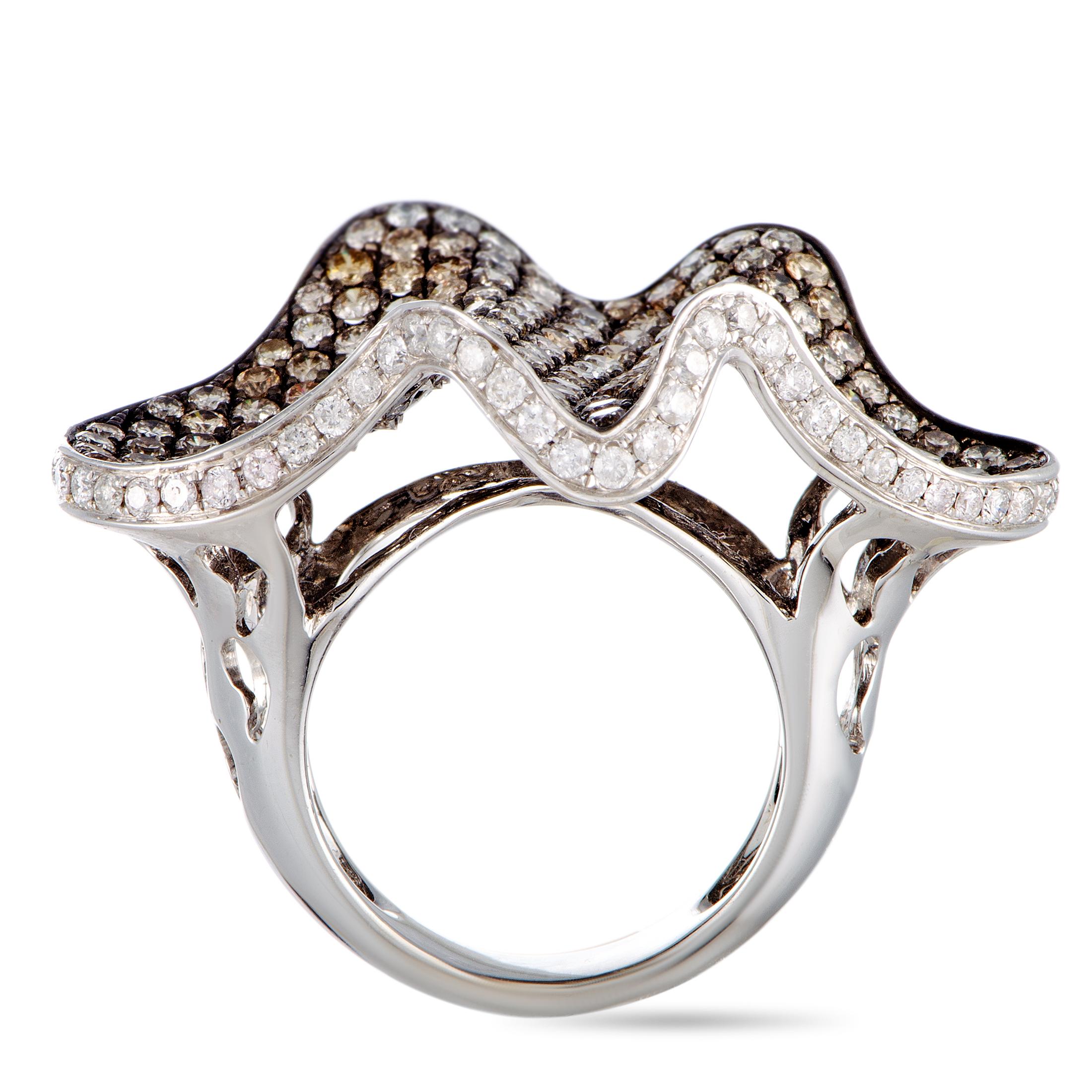 This ring is made out of 18K white gold and diamonds that amount to 6.50 carats. The ring weighs 16.8 grams and boasts band thickness of 5 mm and top height of 10 mm, while top dimensions measure 25 by 37 mm.

Offered in estate condition, this item