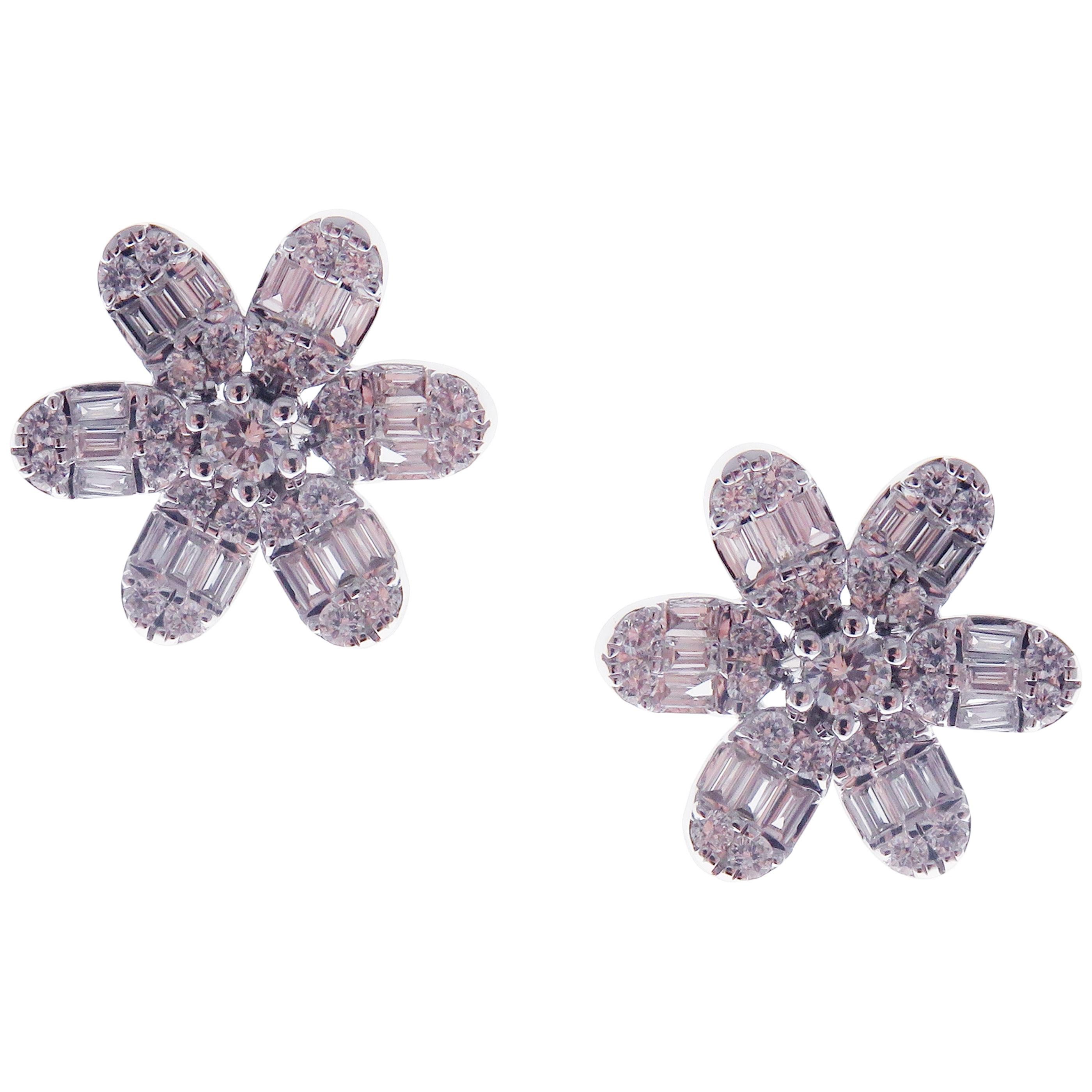 These classic flower stud earrings with round and baguette white diamonds are crafted in 18-karat white gold, featuring 50 round white diamonds totaling of 0.59 carats and 36 baguette white diamonds totaling of 0.39 carats.
These earrings come with