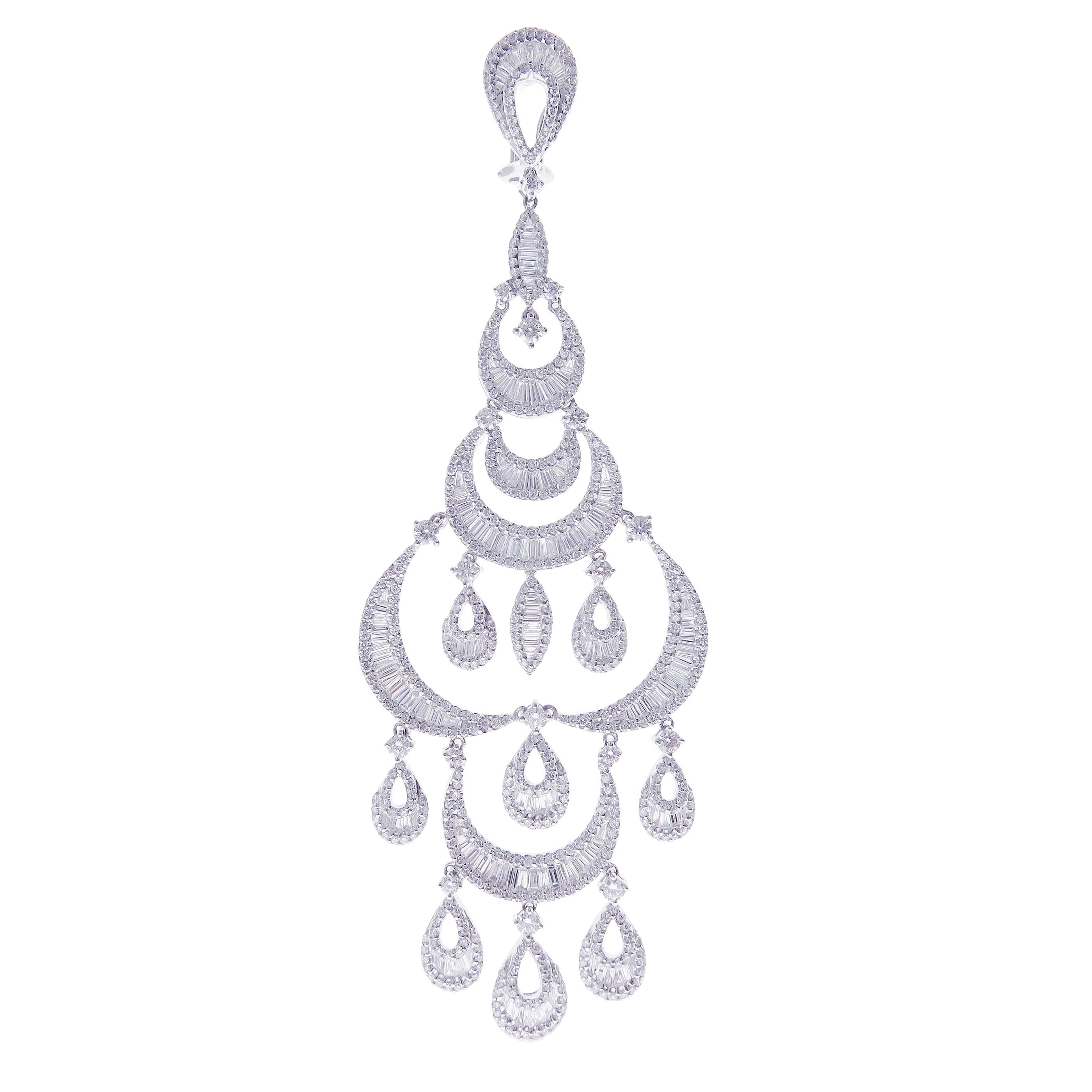 These crescent pear baguette earrings are crafted in 18-karat white gold, weighing approximately 11.55 total carats of SI-V Quality white diamond. French Clip backing. 

Our Ballroom Chandelier Collection feature earrings for those with bold/classy