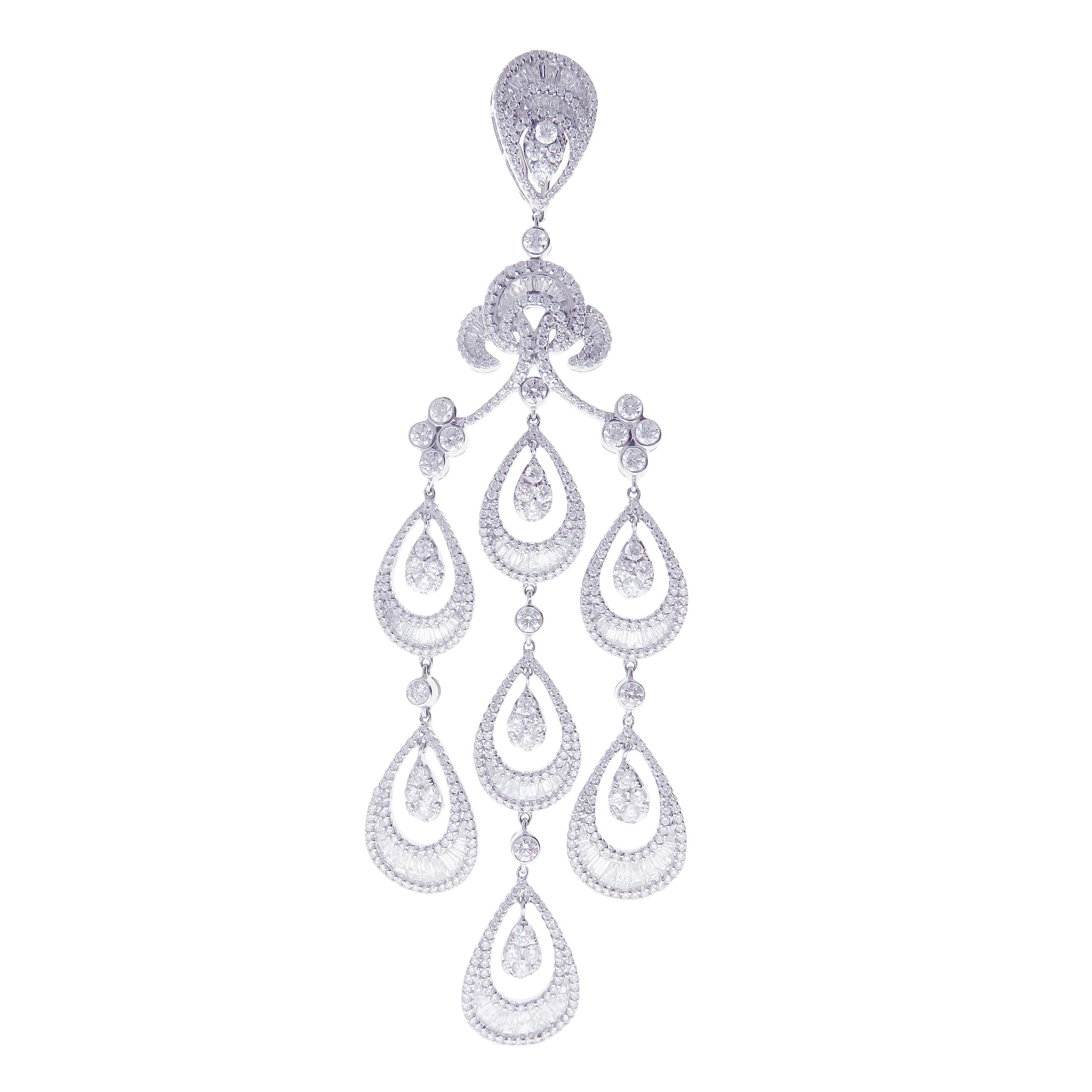 These hollow pear baguette earrings are crafted in 18-karat white gold, weighing approximately 14.55 total carats of SI-V Quality white diamond. French Clip backing. 

Our Ballroom Chandelier Collection feature earrings for those with bold/classy