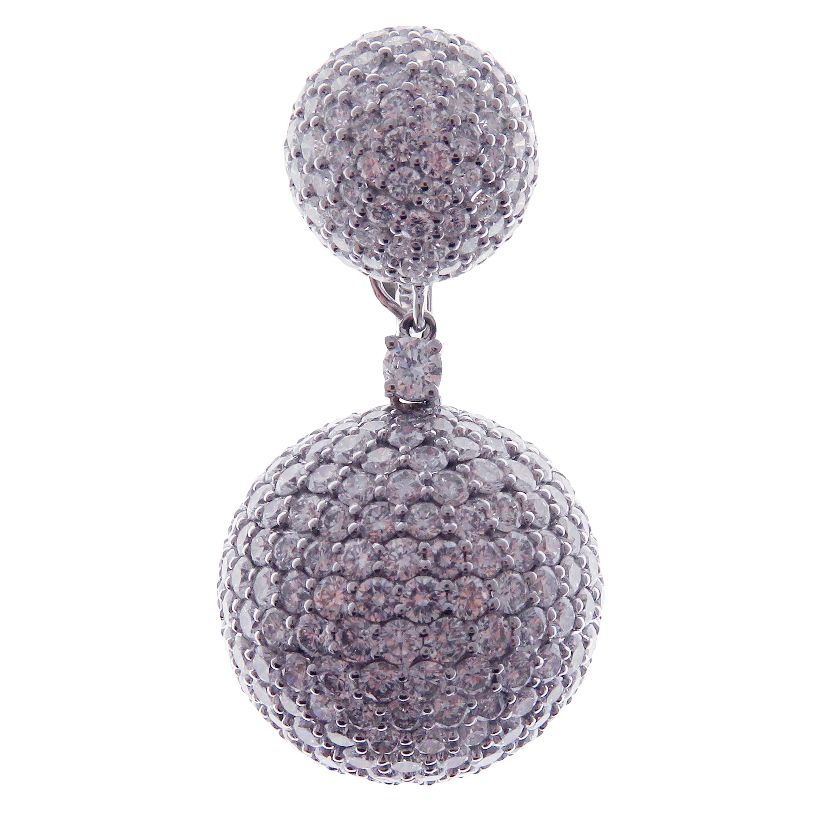 These ball pave earrings are crafted in 18-karat white gold, weighing approximately 25.80 carats of V-Quality white diamond with 786 round diamonds. French clip backing on top. 

Beautiful 0.15 pt white diamond accent on each earring and