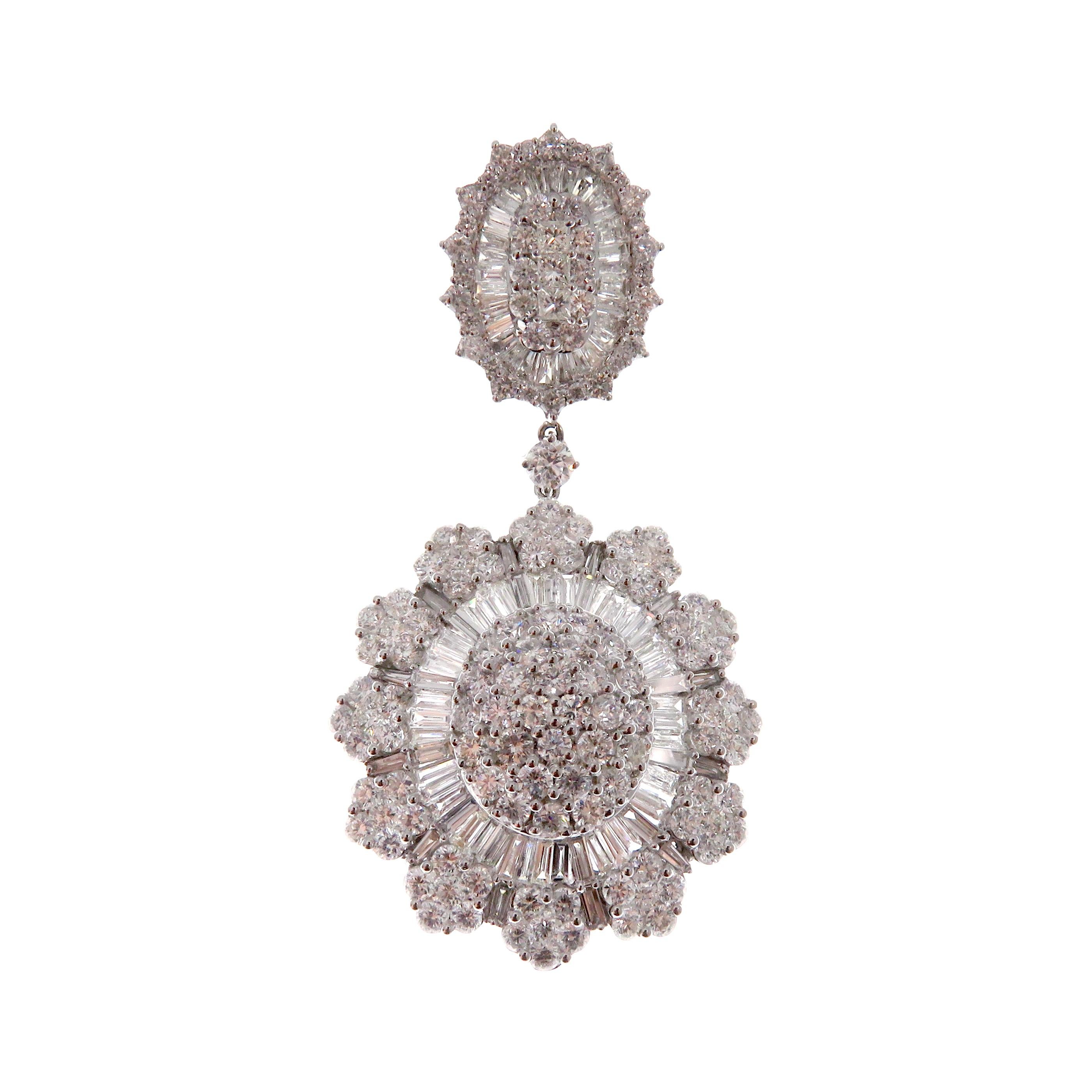 These sunflower inspired baguette earrings are crafted in 18-karat white gold, weighing approximately 17.23 total carats of SI-V Quality white diamond. Beautiful pave centered design. French Clip backing. 

Our Ballroom Collection feature earrings