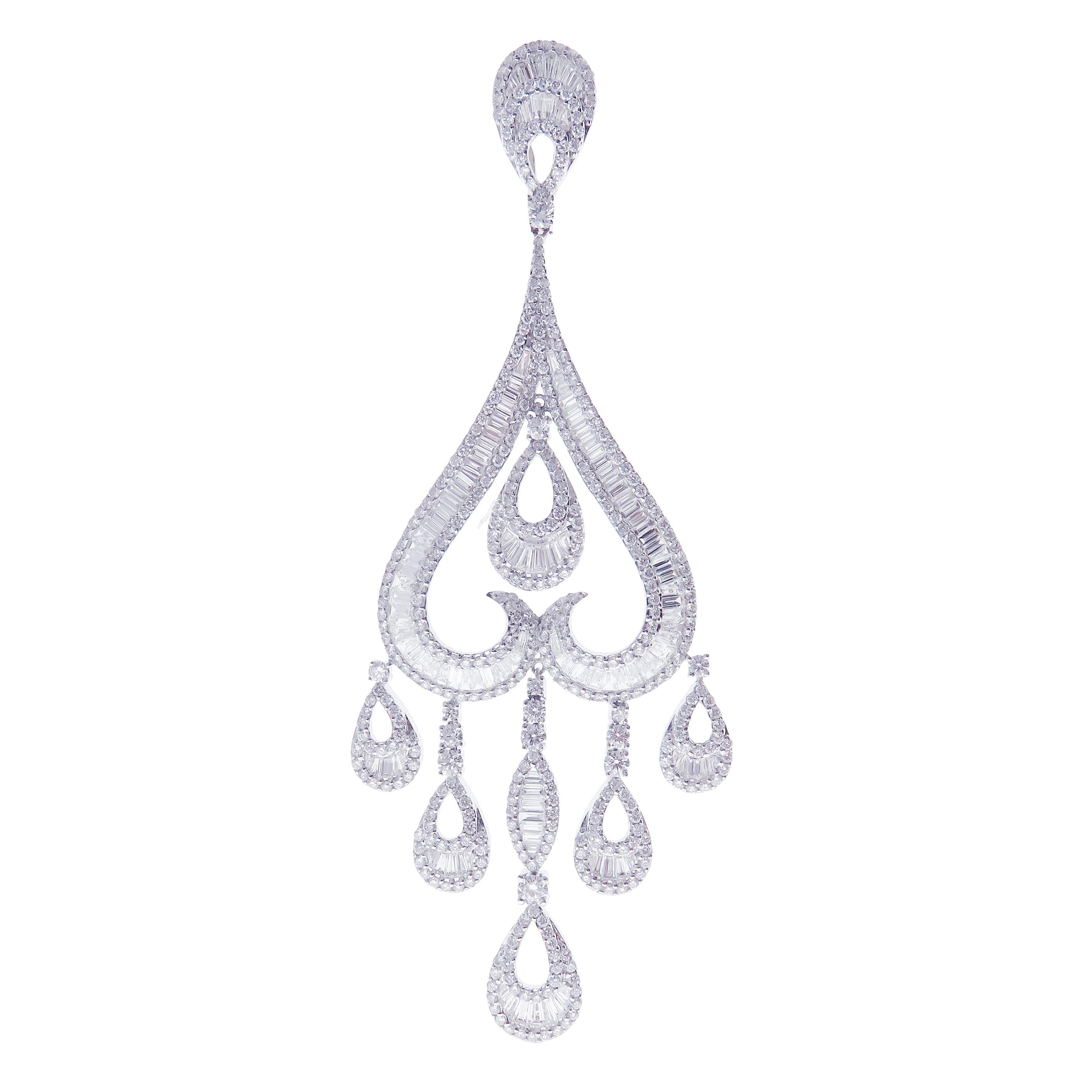 These under heart baguette earrings are crafted in 18-karat white gold, weighing approximately 11.00 total carats of SI-V Quality white diamond. French Clip backing. 

Our Ballroom Chandelier Collection feature earrings for those with bold/classy