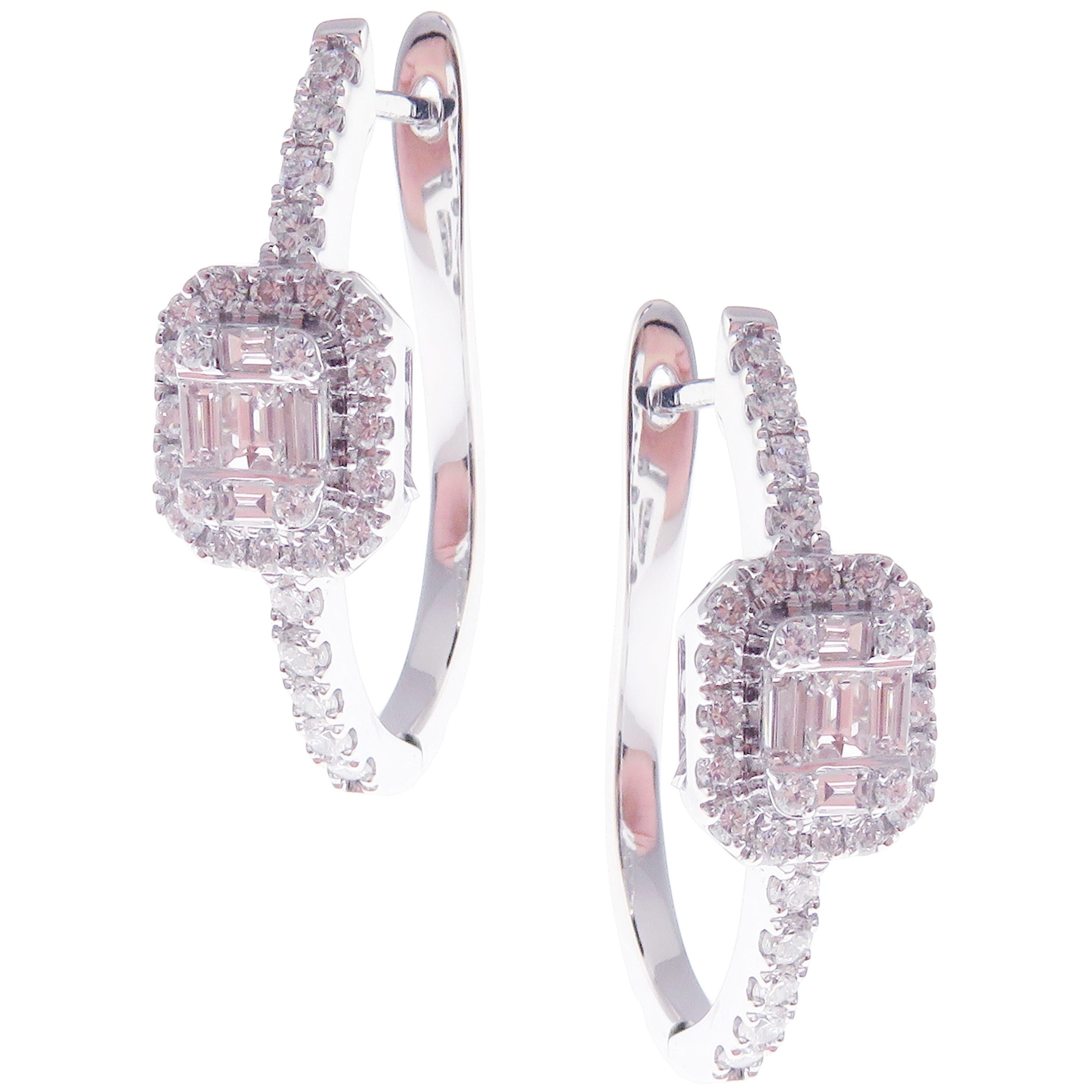 These timeless huggie earrings with cushion-shaped illusion-setting white diamonds are crafted in 18-karat white gold, featuring 58 round diamond totaling of 0.57 carats and 10 baguette diamonds totaling of 0.29 carats; VS-G Quality white diamonds.
