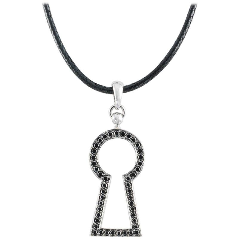 This LOVE Lock Pendant with white diamonds is handcrafted in white gold, sterling silver, rhodium on a cotton cord.

Stones: WHite (F-G/VVS) diamonds: 0,26ct.
Material: White Gold 18k, Sterling Silver 925, Black Rhodium

The Pendant is available