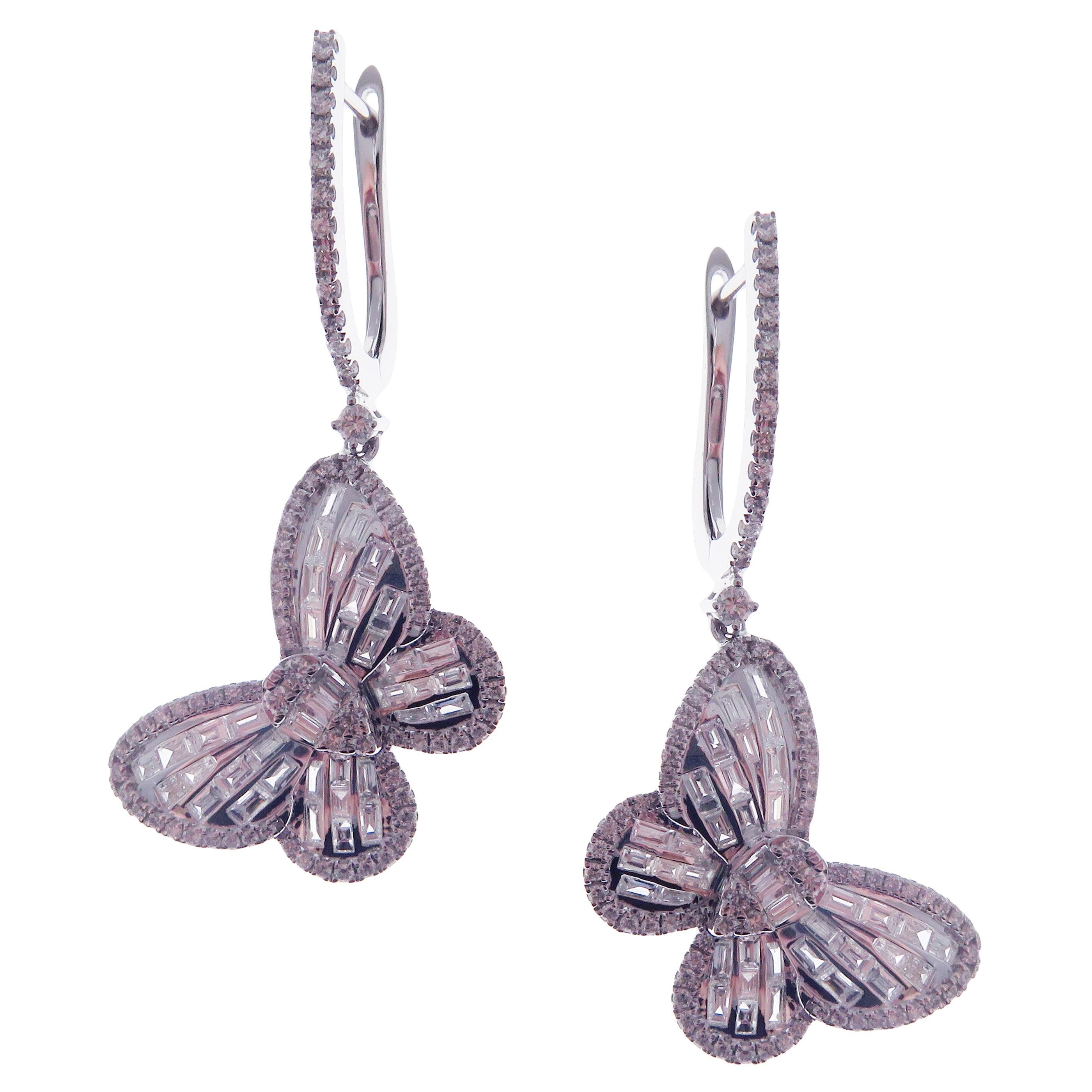 These classic butterfly dangling earrings with white round diamonds and baguette diamonds are crafted in 18-karat white gold, featuring 156 round white diamonds totaling of 0.75 carats and 78 baguette white diamonds totaling of 1.42 carats.
These