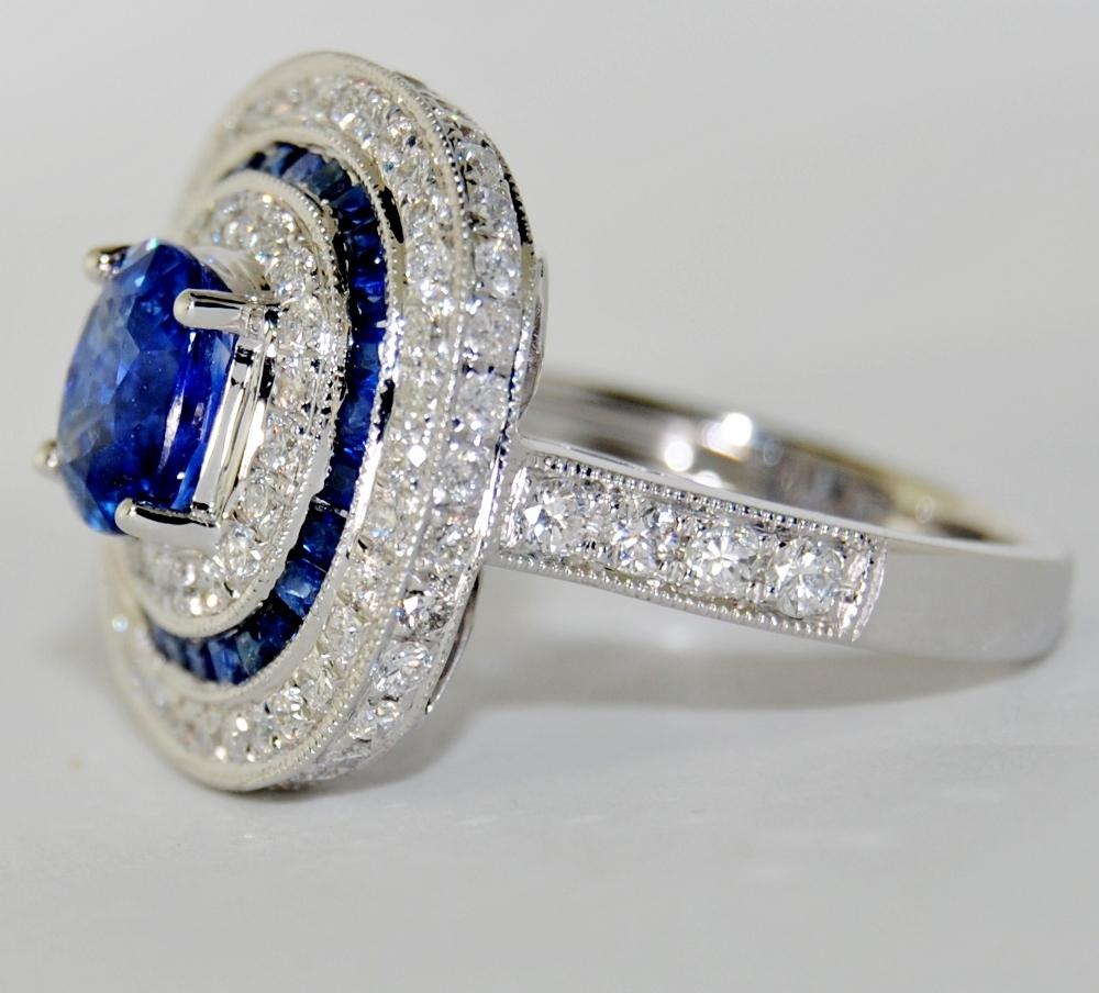 Modern 18 Karat White Gold with Blue Oval Sapphire and White Diamond Ring For Sale