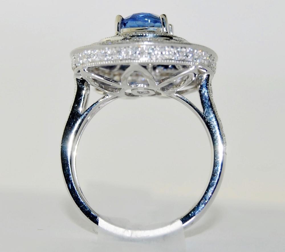 Oval Cut 18 Karat White Gold with Blue Oval Sapphire and White Diamond Ring For Sale