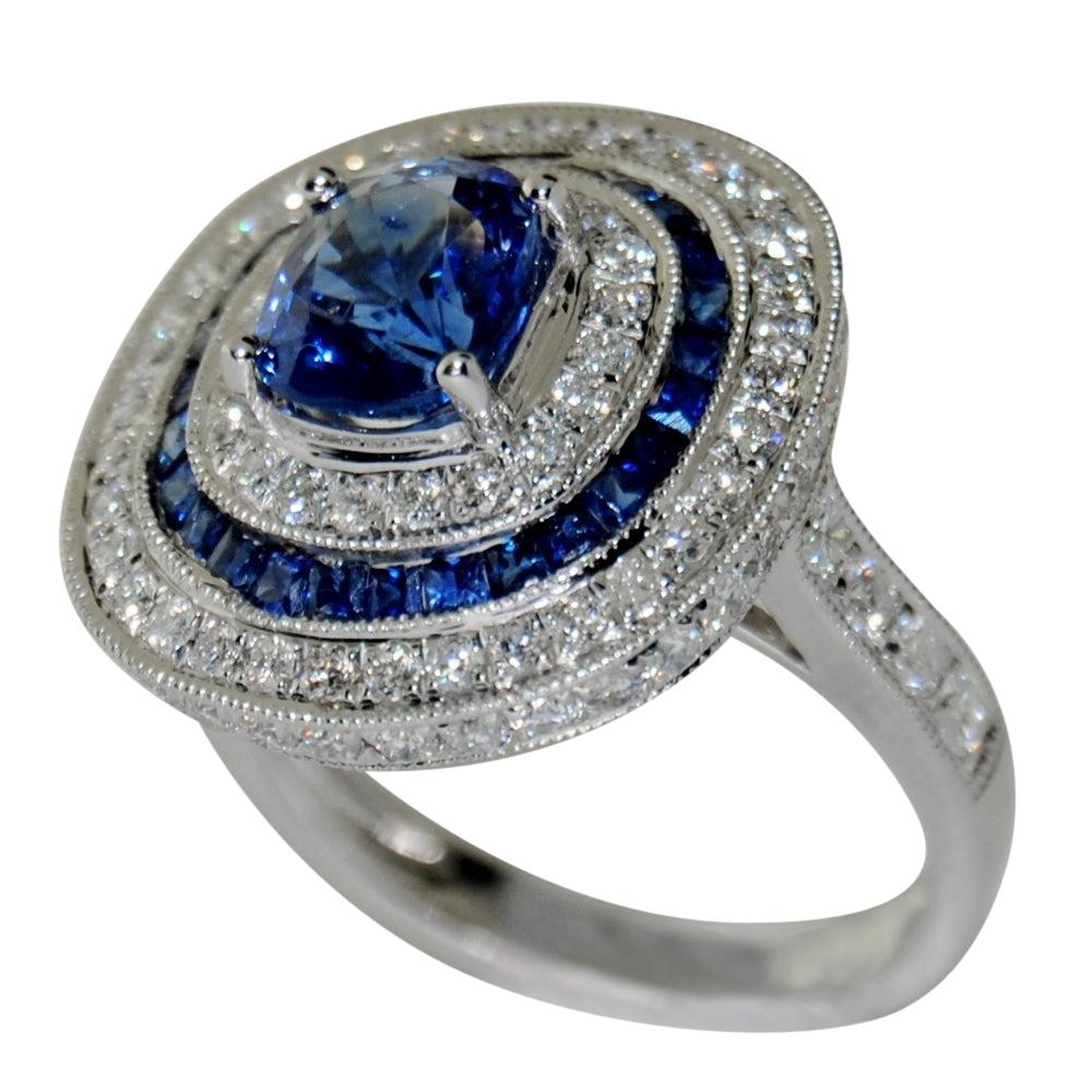 18 Karat White Gold with Blue Oval Sapphire and White Diamond Ring For Sale