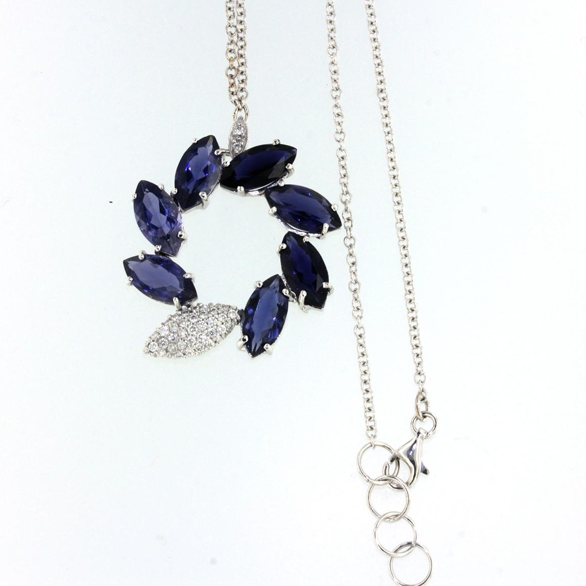 Sunflowers are symbols of sun and happiness. It takes inspiration from modern shapes and Nature
Necklace composed by pendant with chain in 18k white gold with Iolite (marquise cut, size: 6x12 mm) and white Diamonds cts 0,40 VS colour G/H.  cm 42