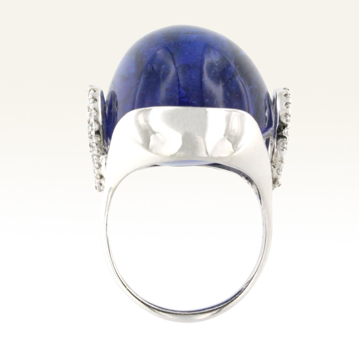 Oval Cut 18 Karat White Gold with Tanzanite and White Diamond Ring For Sale