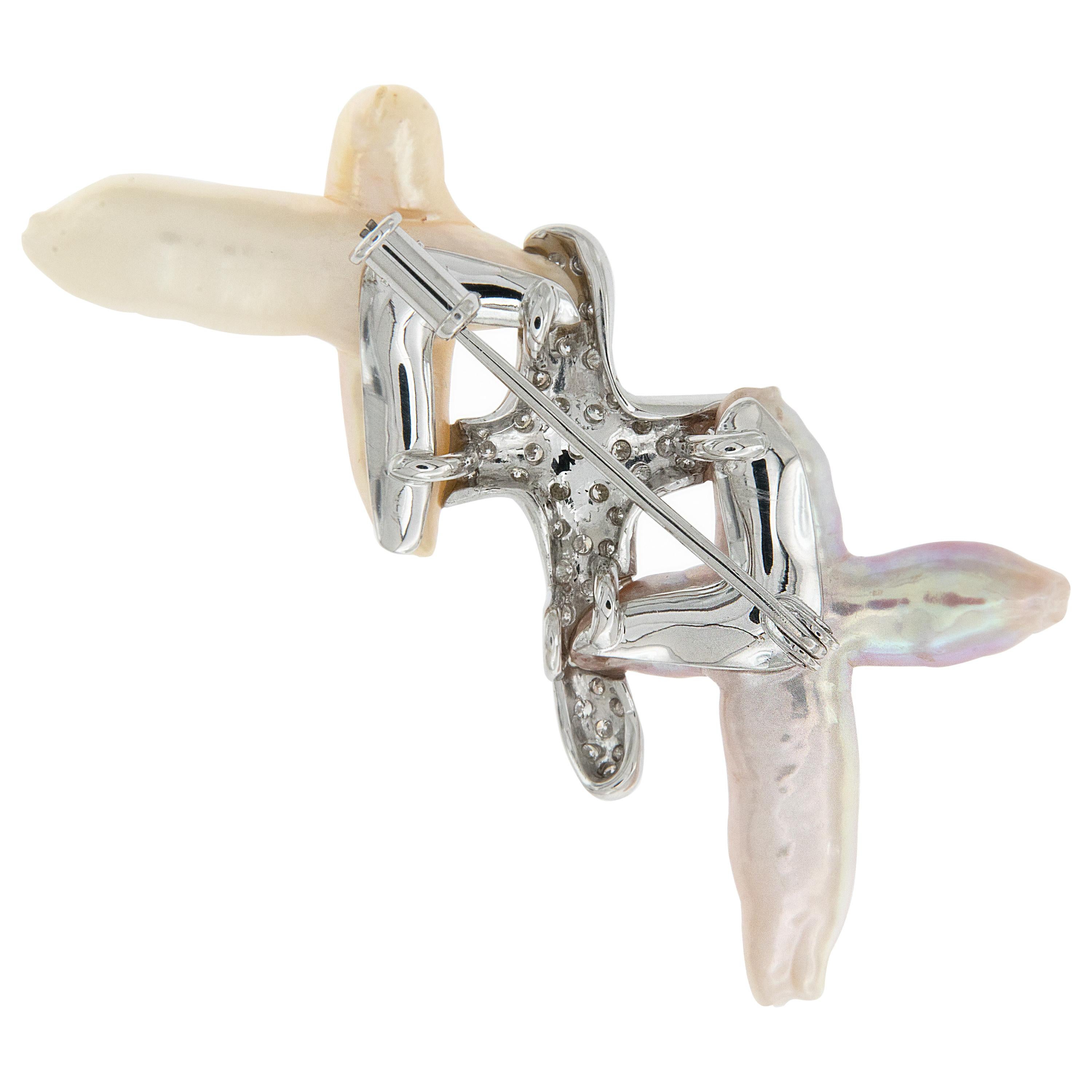 Schoeffel, a luxury brand known for their exquisite pearls for 4 generations created this eye catching brooch. Triple 