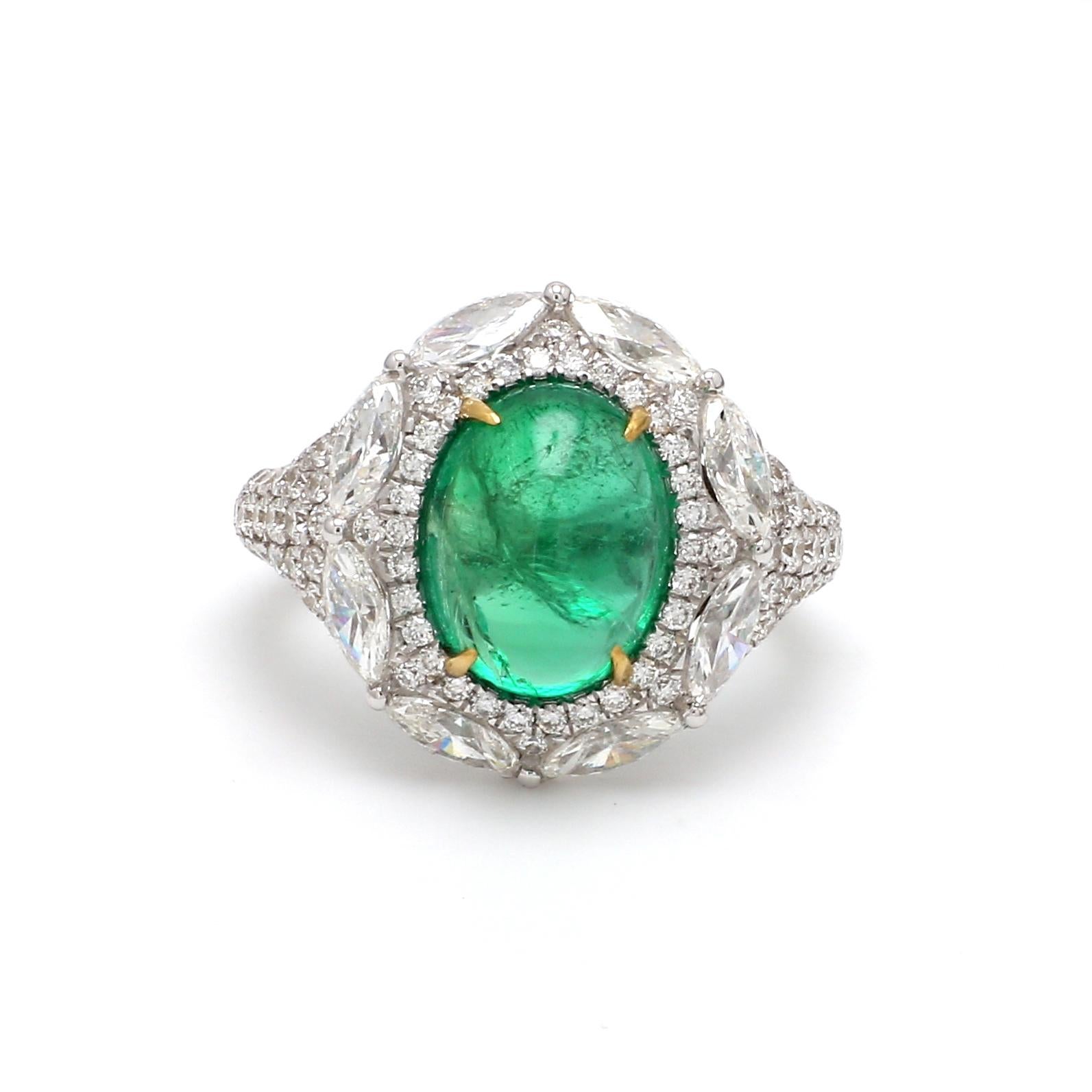 A Beautiful Handcrafted Ring in 18 karat Gold with Natural Emerald of Zambian origin and Brilliant Cut Colorless Diamonds Cocktail Ring totaling 2.80 Carat Diamond and 1 Piece Emerald 3.89 Carat.

Emerald Details
Weight: 3.89 carats
Natural Emerald
