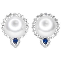 18 Karat White South Sea Pearls, Diamonds and Sapphire Omega Back Earrings