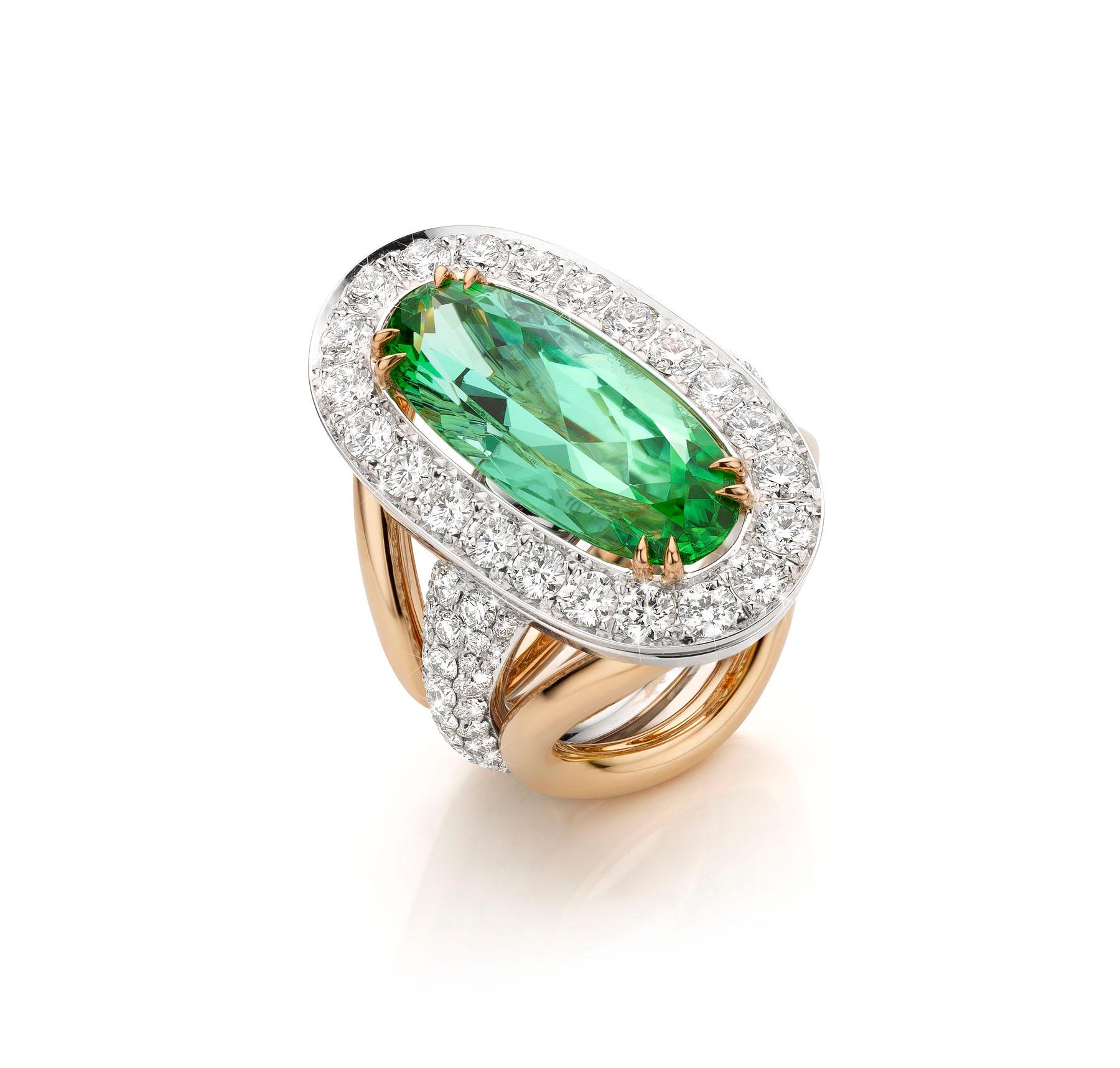 18 Karat White & Yellow Gold Cocktail Ring featuring a 10.37 carat Vivid Mint Green Tourmaline stone.

Oval cut measuring 22.7 x 9.8mm.
The Mint Tourmaline is embraced by D Flawless Collection Grade Diamonds weighing 14.57 carat.

This ring was