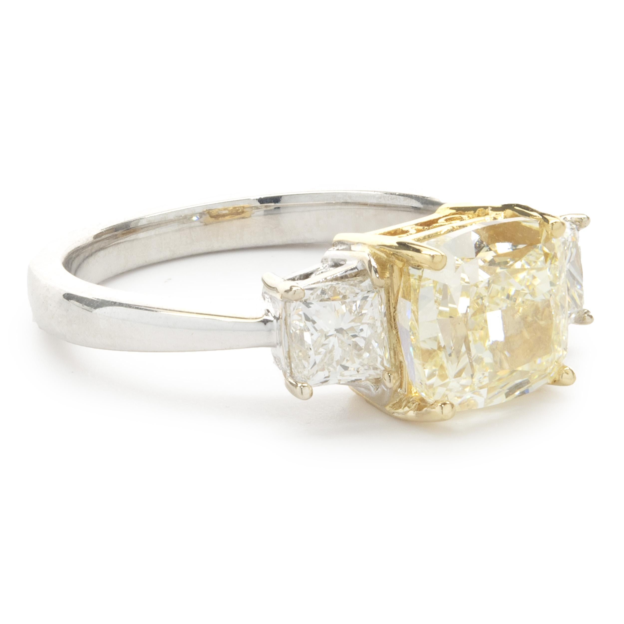 Designer: custom
Material: 18K white & yellow gold
Diamond: 1 cushion cut = 2.51ct
Color: Fancy Light Yellow
Clarity: VVS2
AIGL:  JK10794
Diamond: 2 princess cut = 0.82ct
Color: G
Clarity: SI1-2
Ring Size: 6.5 (please allow two additional shipping
