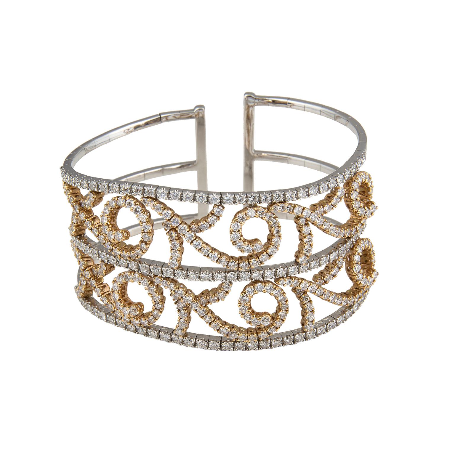 Cuff bracelet in 18 Karat white and rose gold set with 318 diamonds, with a total weight of 8.80 carats.
Circumference: 17 cm (6.69 in)
Width: 3,5 cm (1.38 in)