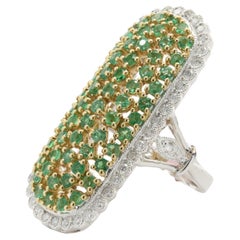 18 Karat White & Yellow Gold Elongated Oval Emerald and Diamond Ring