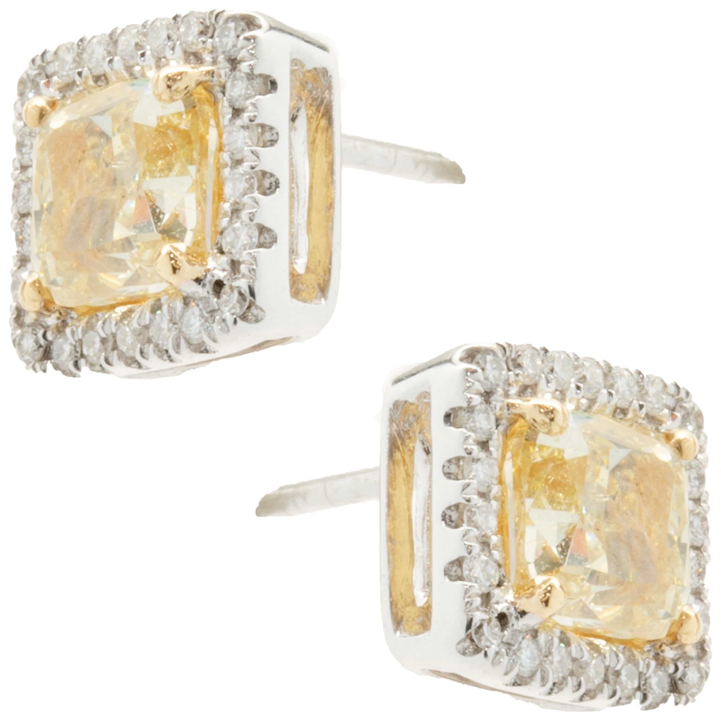 Material: 18k white & yellow gold
Diamonds: 2 cushion cut = 1.74cttw
Color: Fancy Yellow
Clarity: SI1
Diamonds: 44 round brilliant cut = 0.18cttw
Color: G
Clarity: VS2
Dimensions: earrings measure approximately 8.3mm in diameter
Fastenings: