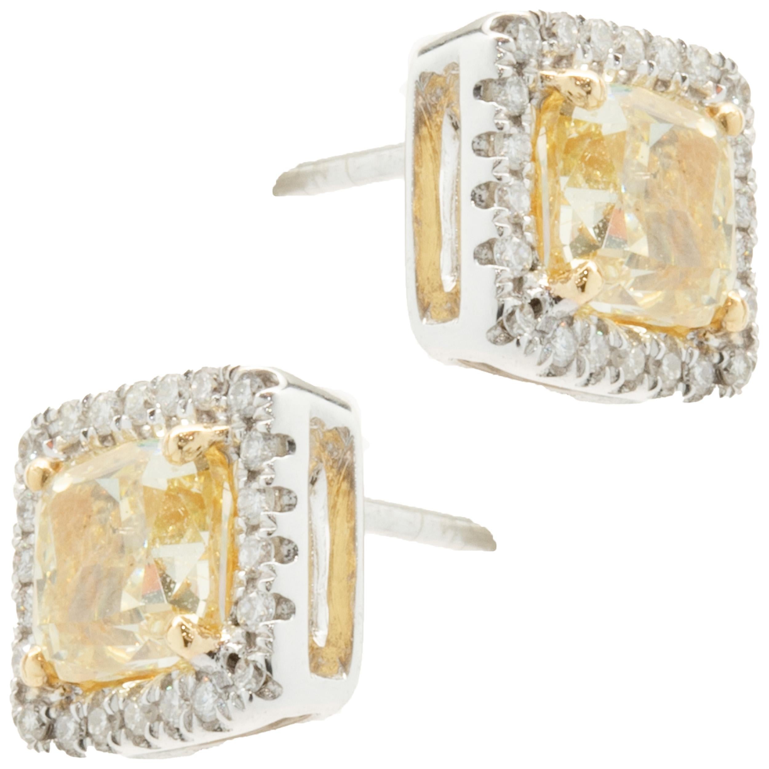 18k White & Yellow Gold Fancy Yellow Diamond Stud Earrings with Diamond Halos In Excellent Condition For Sale In Scottsdale, AZ