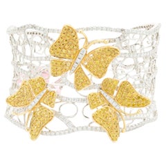 Bracelet manchette fleur en or blanc et jaune 18 carats avec pavé de diamants papillons