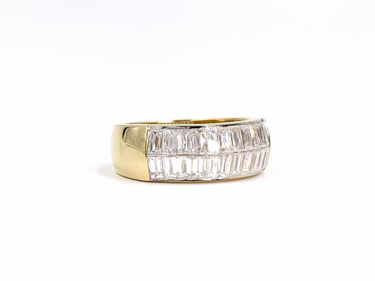 Expertly crafted by Cristopher Designs, this solid 18 karat yellow gold 7mm band features two rows of invisibly set L'Amour Crisscut baguette diamonds at 1.99 carats total weight. L'Amour crisscut diamonds have more cuts, enhanced scintillation and