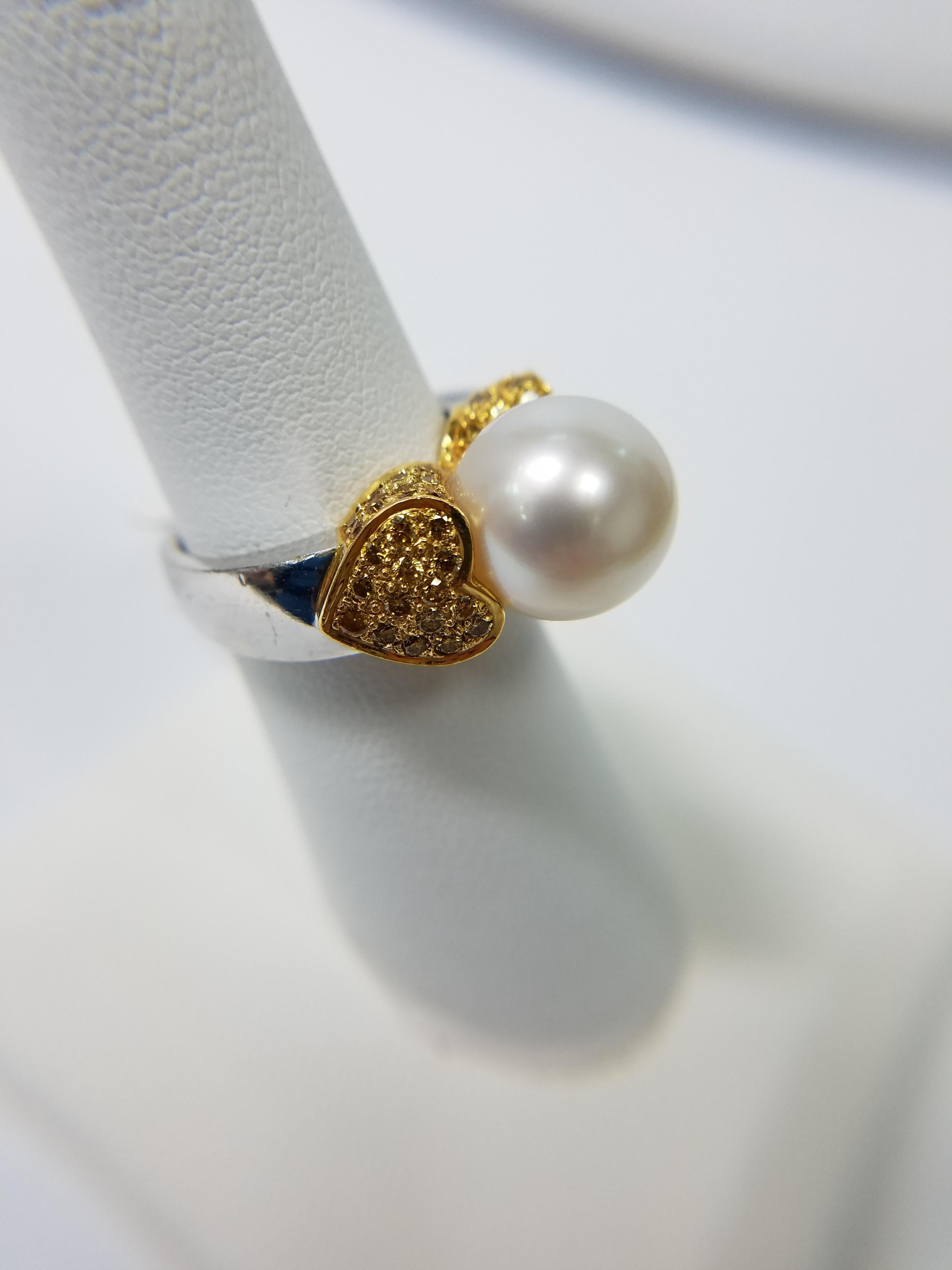 18K yellow and white gold ring with aprox 1.20 carats of Natural Fancy yellow Diamonds and a 11.55 mm South Sea Pearl