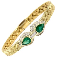 18 Karat Woven Bangle with Emeralds and Diamonds