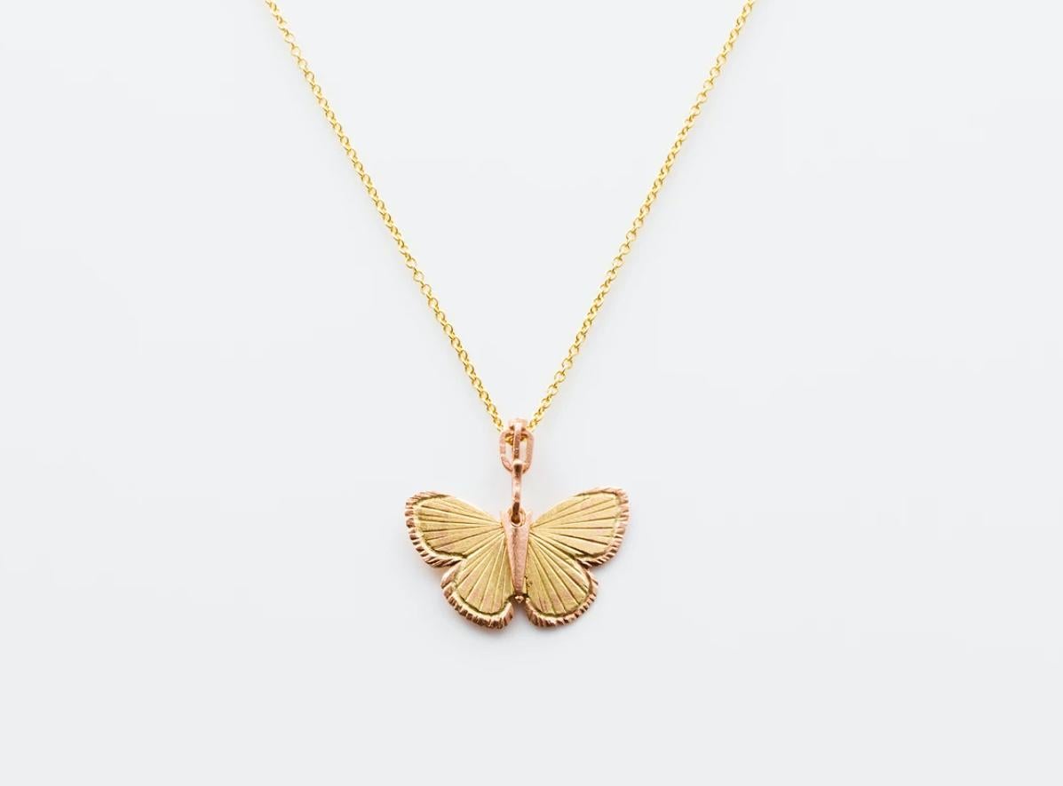 James Banks's signature butterfly necklace features a Palos Verde butterfly with a hinge at the center to allow movement of the wings, set in 18k Yellow Gold with 14k Rose Gold inlay trim, 14k Rose Gold hook and crown, hung on a 17
