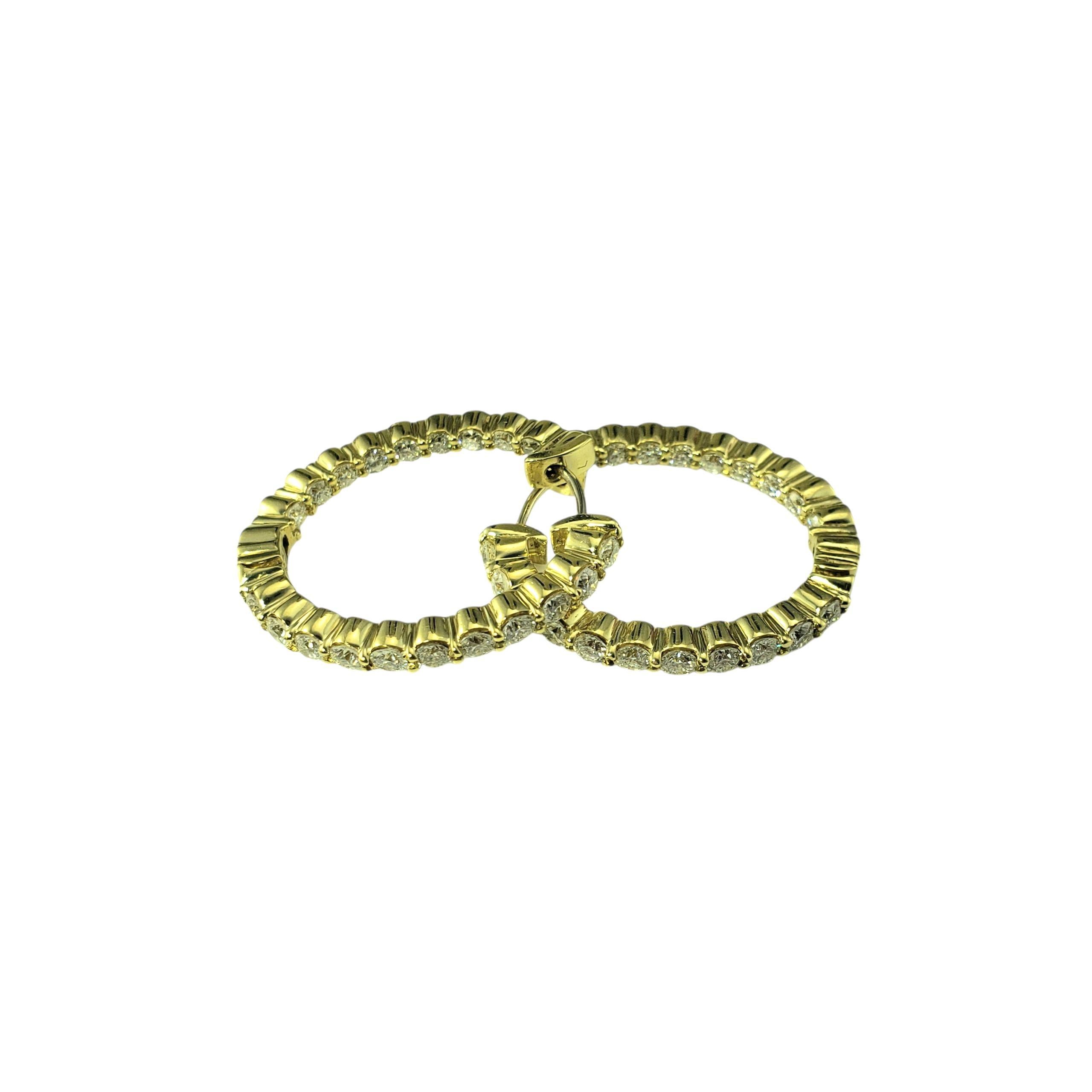 18K Yellow Gold Inside Out Hoop Earrings-

Elevate your elegance with these stunning inside-out oval hoop diamond earrings, crafted in luxurious 18K yellow gold. Each earring features 20 round brilliant cut diamonds, offering maximum sparkle from