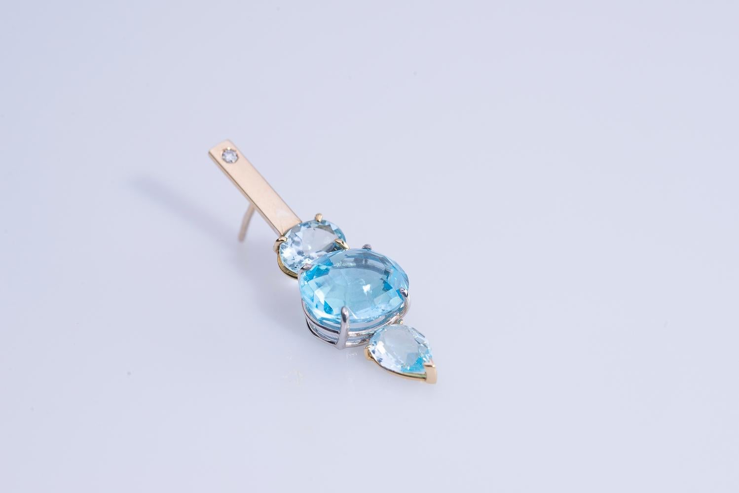 Round Cut 18 Karat Yellow and White Gold Blue Topaz 0.16 Karat White Diamonds Earrings For Sale