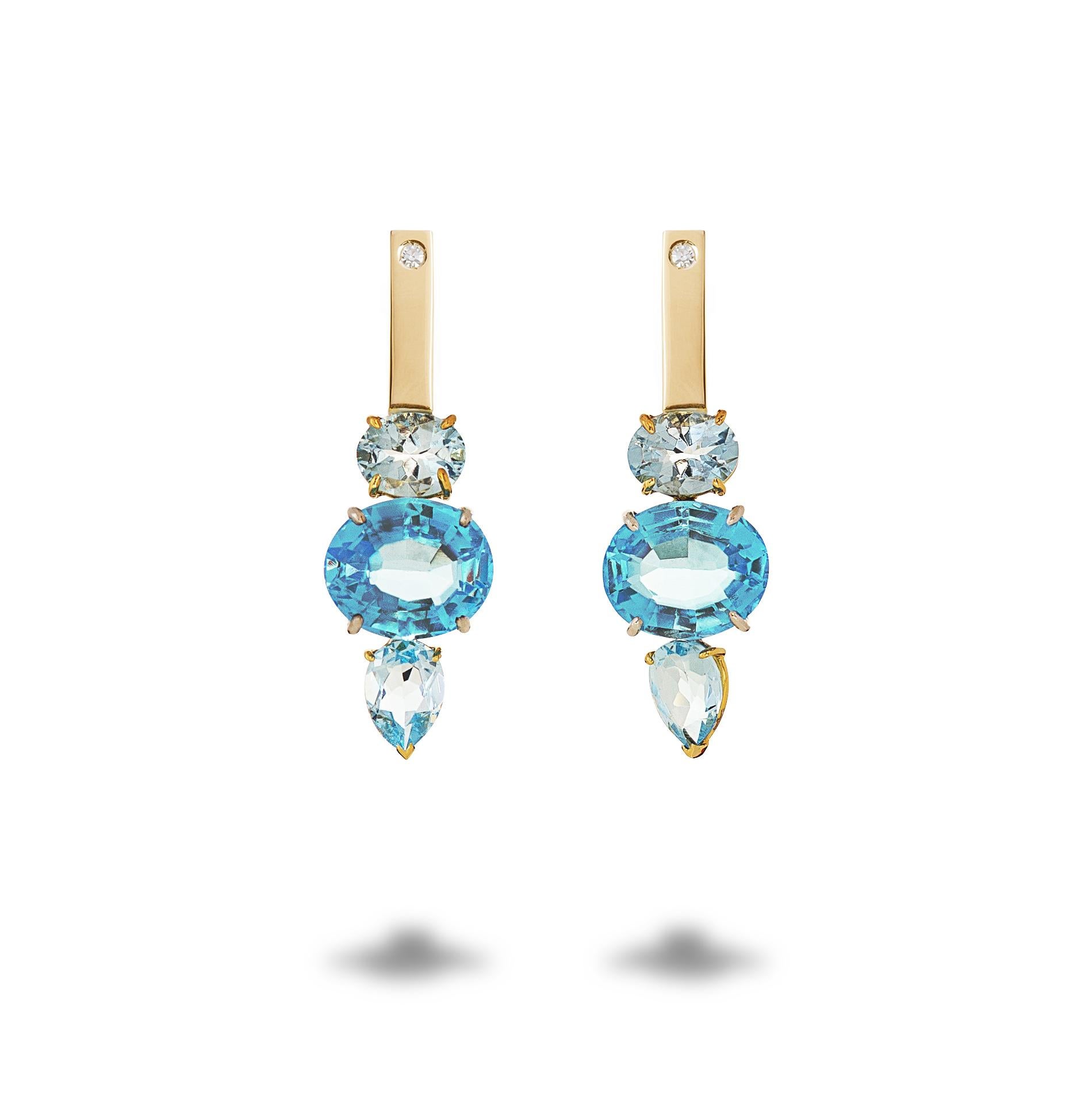  18 Karat Yellow&White Gold Blue Topaz 0.16 Karat White Diamonds Earrings
These earrings reminds of a dip in the ocean. The colour of the topaz is like the light blue of the clean water and the white diamonds are like the sea foam. Definitely for