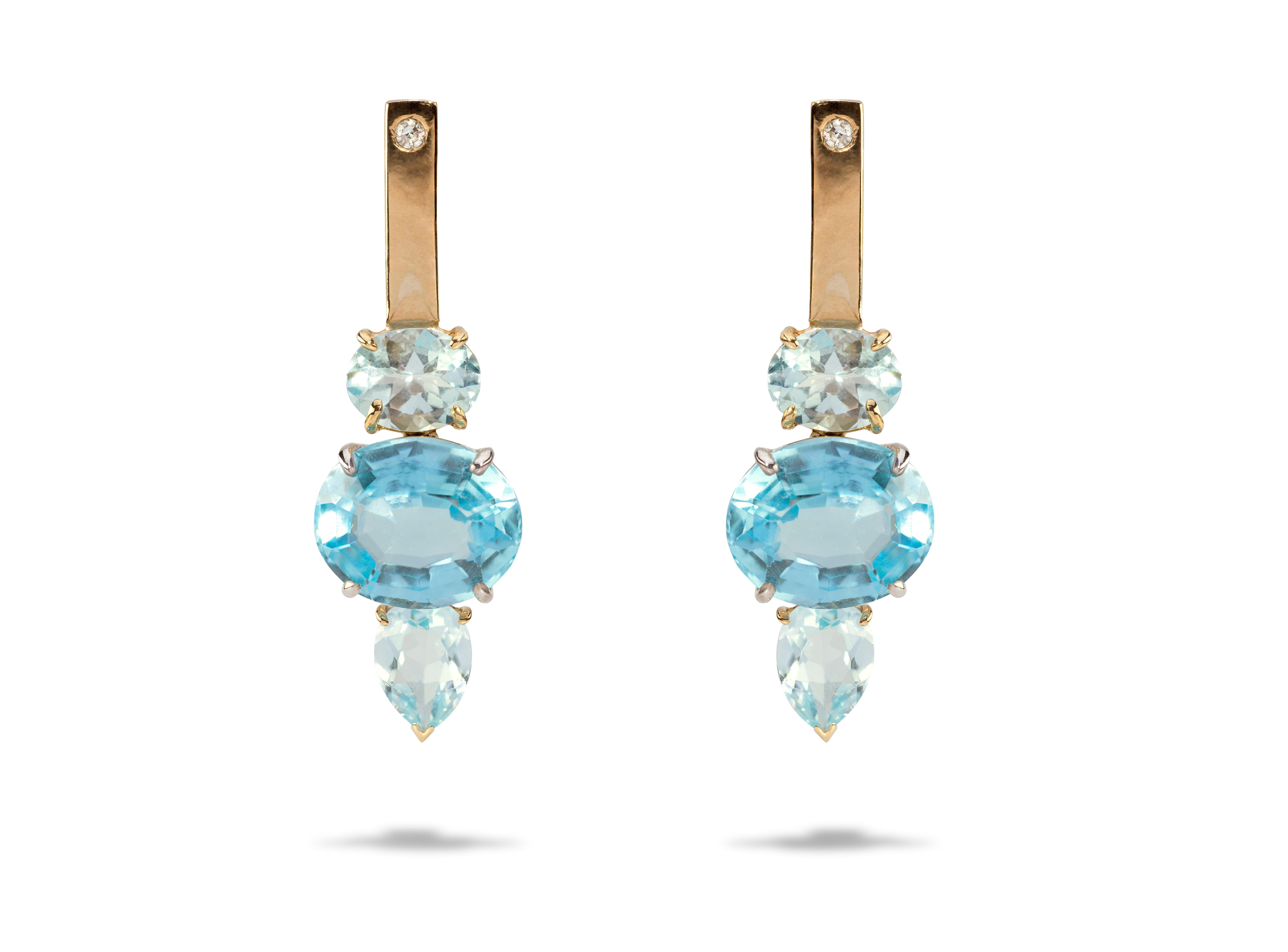  18 Karat Yellow&White Gold Blue Topaz 0.16 Karat White Diamonds Design Earrings
These earrings reminds of a dip in the ocean. The colour of the topaz is like the light blue of the clean water and the white diamonds are like the sea foam. Definitely