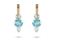 18 Karat Yellow and White Gold Blue Topaz 0.16 Karat White Diamonds Earrings