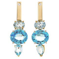 18 Karat Yellow and White Gold Blue Topaz 0.16 Karat White Diamonds Earrings