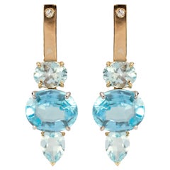 18 Karat Yellow and White Gold Blue Topaz 0.16 Karat White Diamonds Earrings