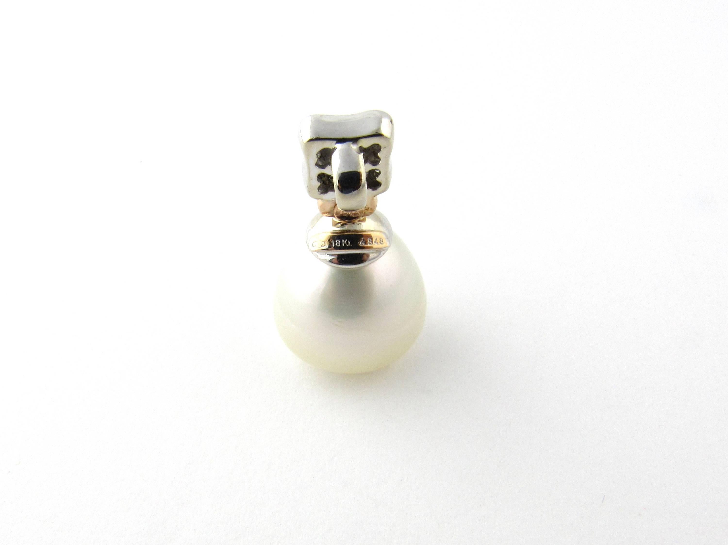Vintage 18 Karat Yellow and White Gold Diamond and Pearl Pendant- 
This stunning pendant features a luminous drop pearl accented with 16 round brilliant cut diamonds set in 14K white gold. 
Approximate total diamond weight: .17 ct. 
Diamond clarity:
