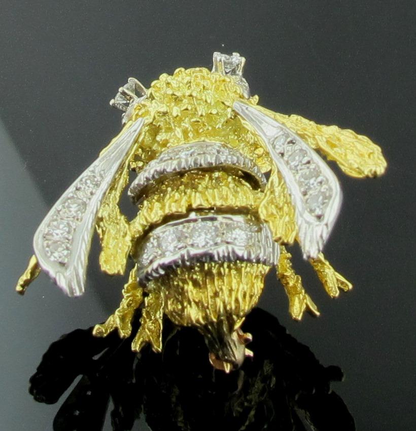 This Bee is in 18 karat yellow gold, adorned with inside wings of white gold and diamonds and two bands of round brilliant cut diamonds in white gold.  Total Diamond weight is 1.00 carats.