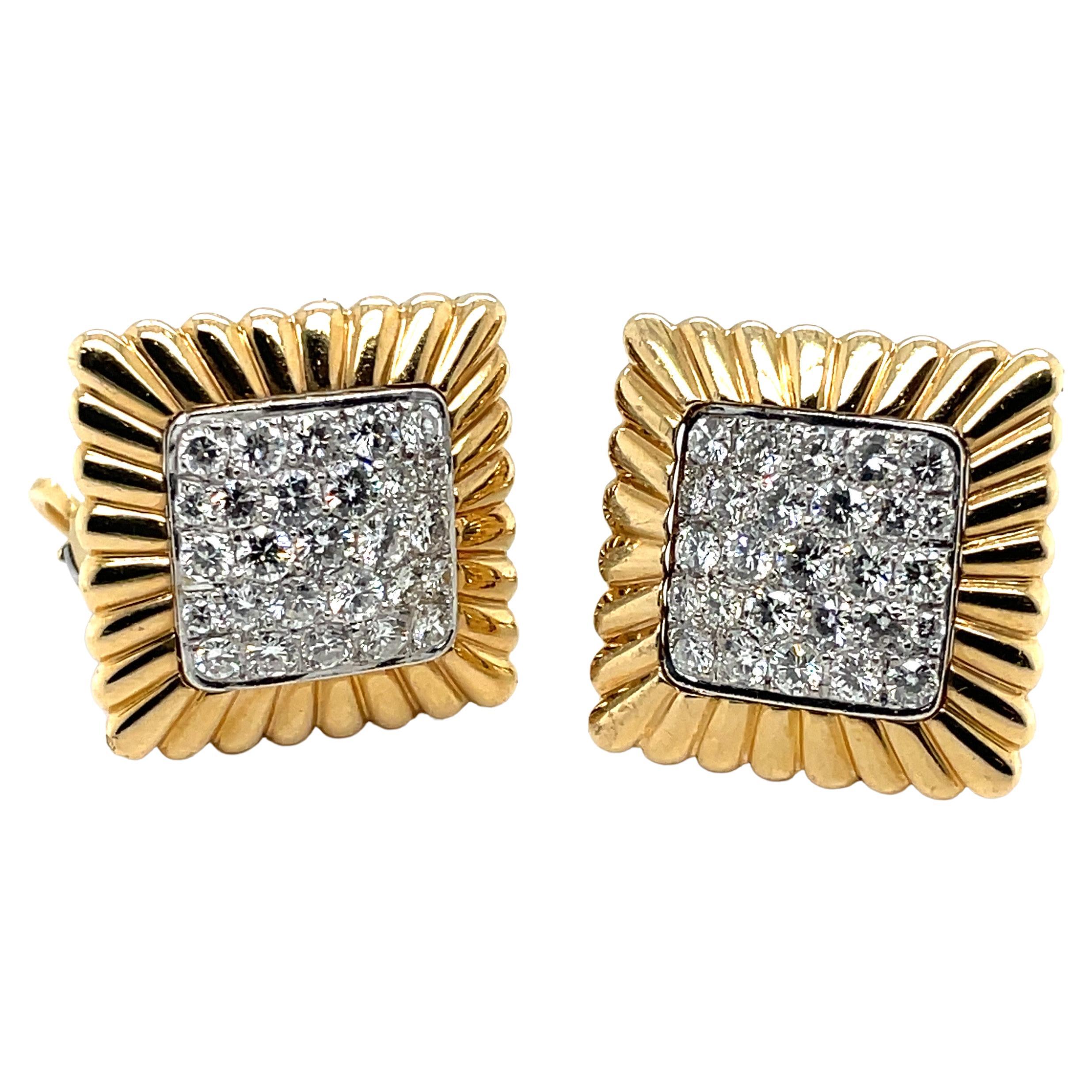 Glamorous pair of 18 karat yellow and white gold diamond earrings, circa 1960s.

Delightful, slightly bombé ear clips, each centering upon a square pavé-set with 25 brilliant-cut diamonds in different sizes totalling circa 5 carats, surrounded by a