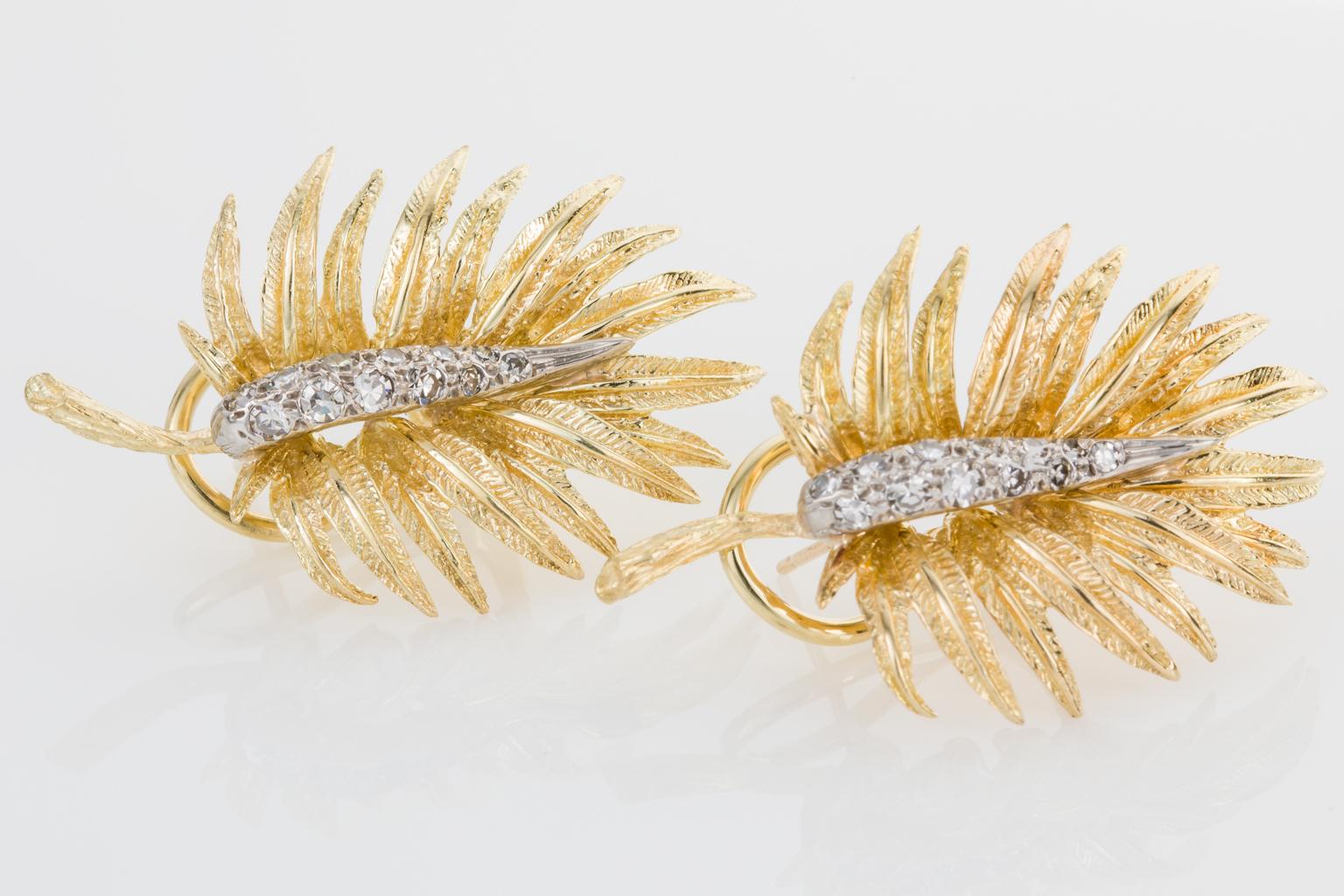A naturalistic pair of earrings depicting a textured fern leaf in 18k yellow gold. The gold work is divine with the leaf fronds showing all the same natural elements with the vein running through the centre of each frond and textured detailing on