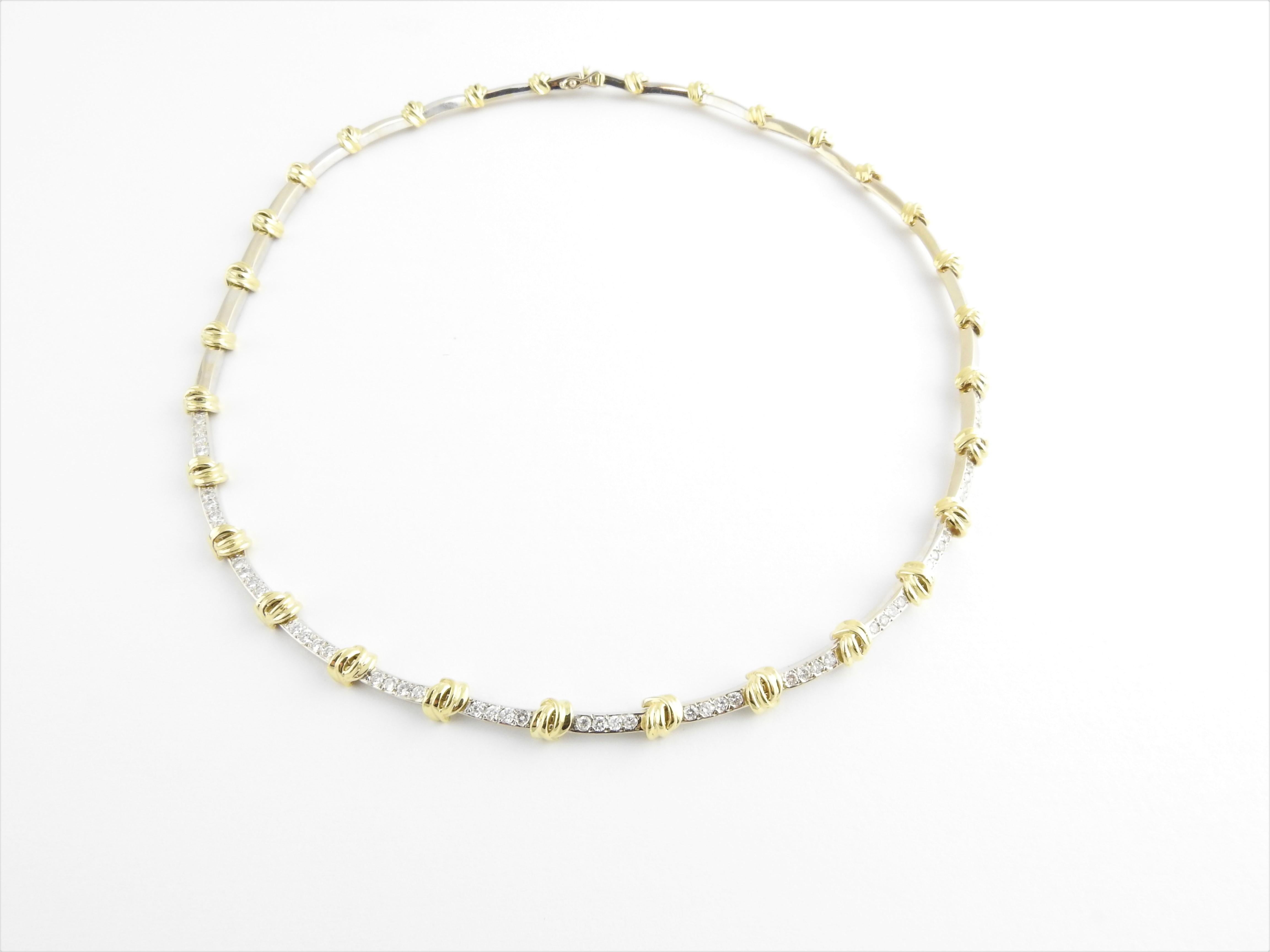 Vintage 18 Karat Yellow and White Gold Diamond Necklace

This spectacular necklace features 62 round brilliant cut diamonds crafted in beautifully detailed 18K white and yellow gold.

Width: 4 mm.

Approximate total diamond weight: 1.24 ct.

Diamond