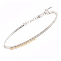 Pulsera brazalete de diamantes de doble hilo de oro amarillo y blanco de 18 quilates