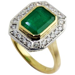 18 Karat Yellow and White Gold Emerald and Diamond Ring