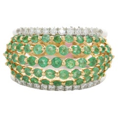 18 Karat Yellow and White Gold Emerald and Diamond Seven Row Cigar Band