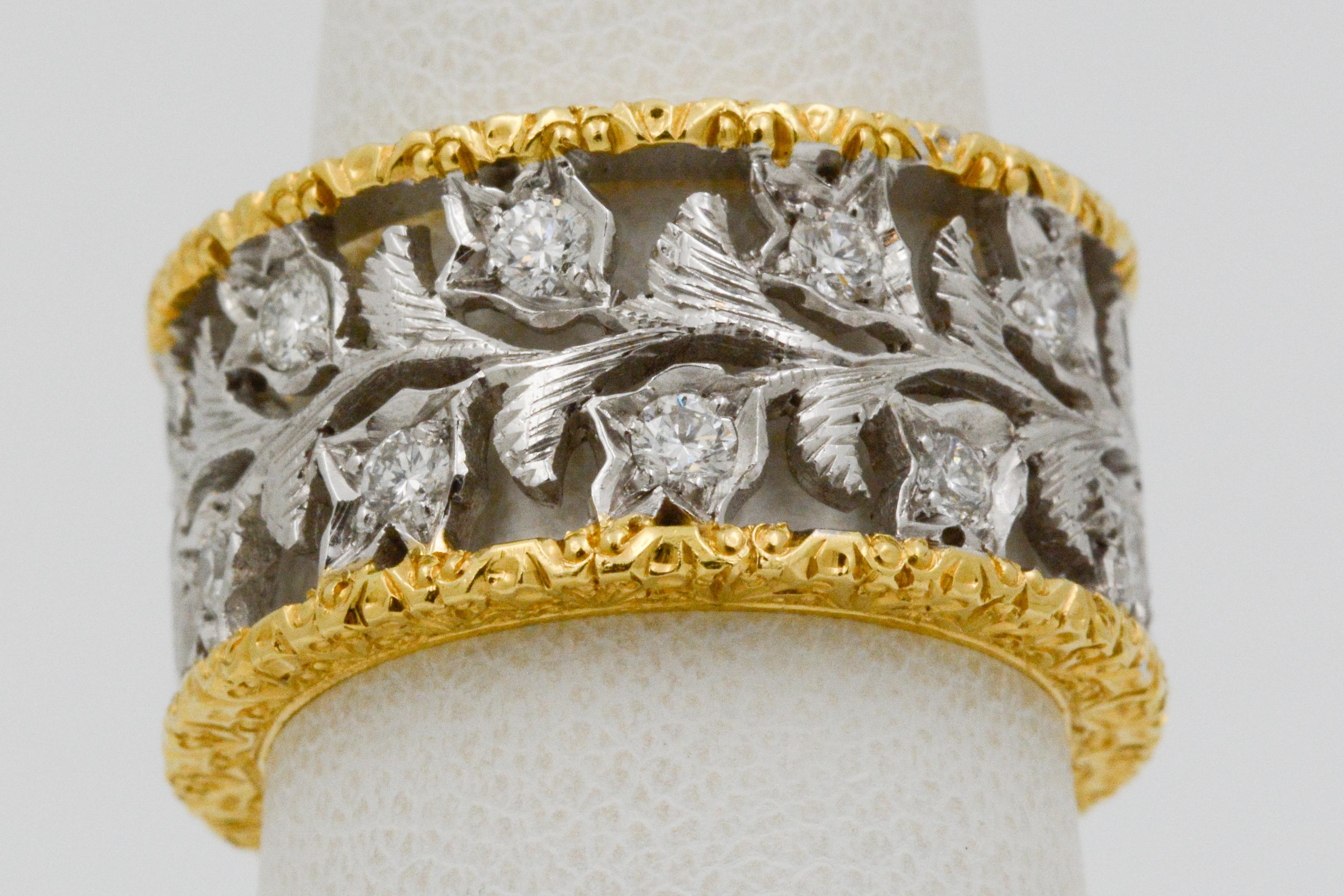 This amazing 18 karat yellow and white gold ring is crafted in an open white gold leaf pattern that extends all the way around the ring, bordered by two hand engraved 18 karat yellow gold rims. The leaf pattern is enhanced with 20 round brilliant