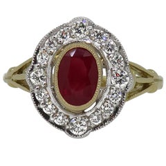 18 Karat Yellow and White Gold Oval Ruby and Diamond Art Deco Style Cluster Ring