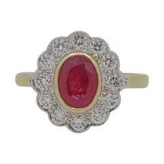 18 Karat Yellow and White Gold Oval Ruby and Diamond Art Deco Style Cluster Ring