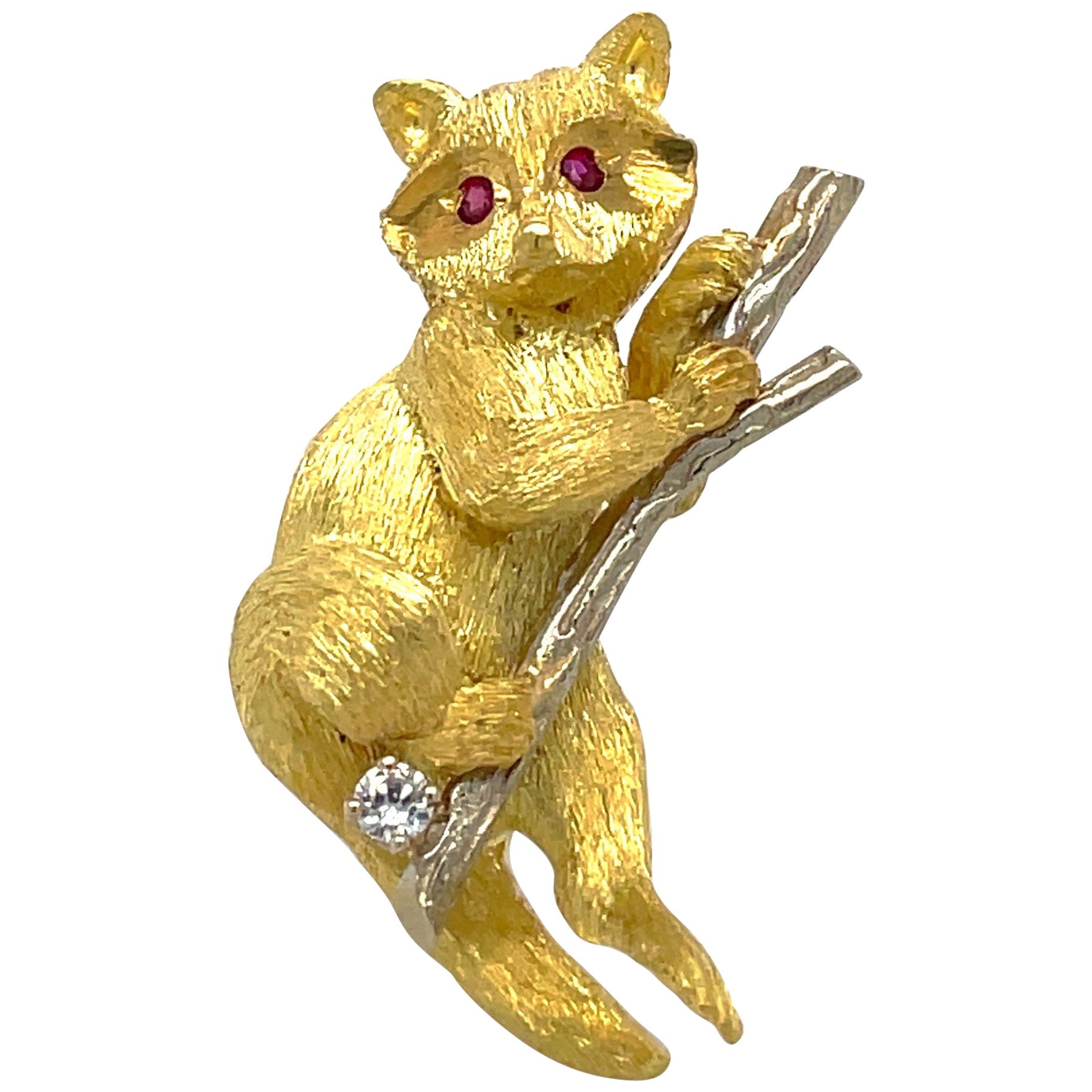 18 Karat Yellow and White Gold Raccoon Brooch with Ruby and Diamond Accents