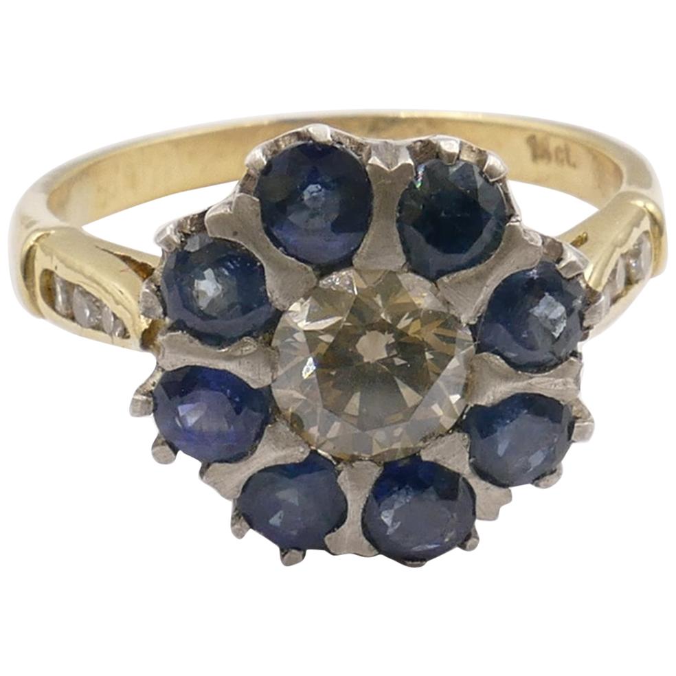 18 Karat Yellow and White Gold Sapphire and Diamond Ring For Sale